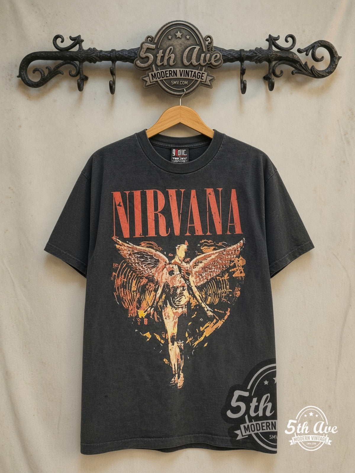 Nirvana – In Utero Sketch Angel Heart-Shaped Box – Vintage Band T-Shirt — front on locked cream ornate 5th Ave rack