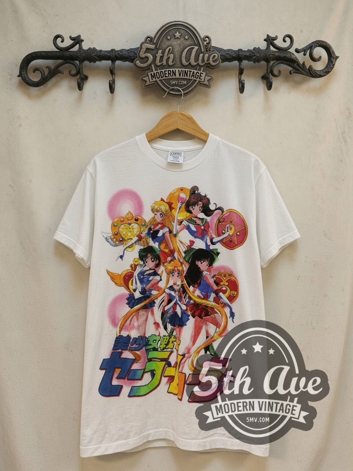 Sailor Moon Full Crew Tribute vintage graphic t-shirt, front view on a display rack