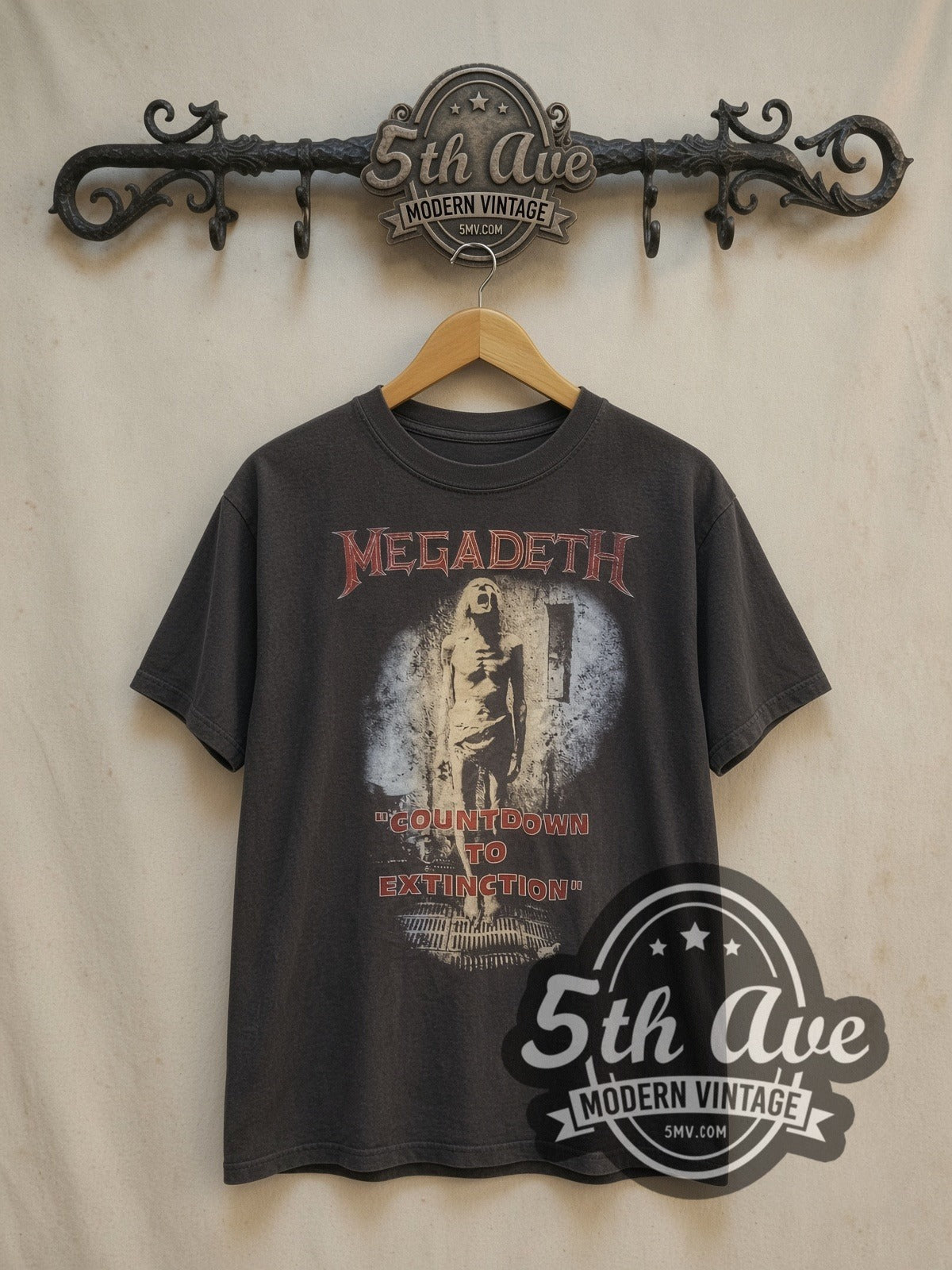 Megadeth Countdown to Extinction' Graphic vintage band t-shirt, front view on a display rack