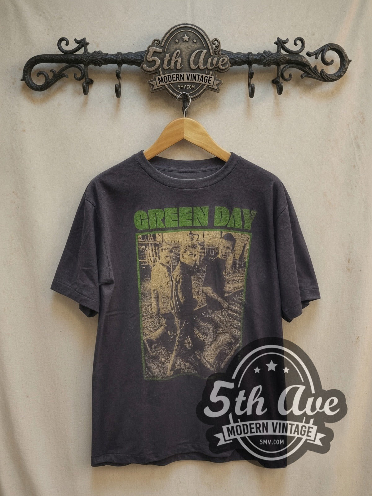 Green Day Green Frame Trio Band Photo vintage band t-shirt, front view on a display rack