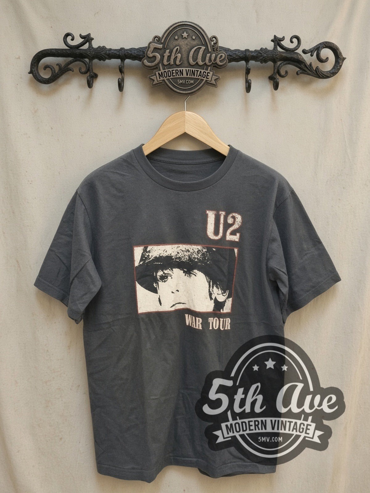 U2 vintage band t-shirt, front view on a display rack