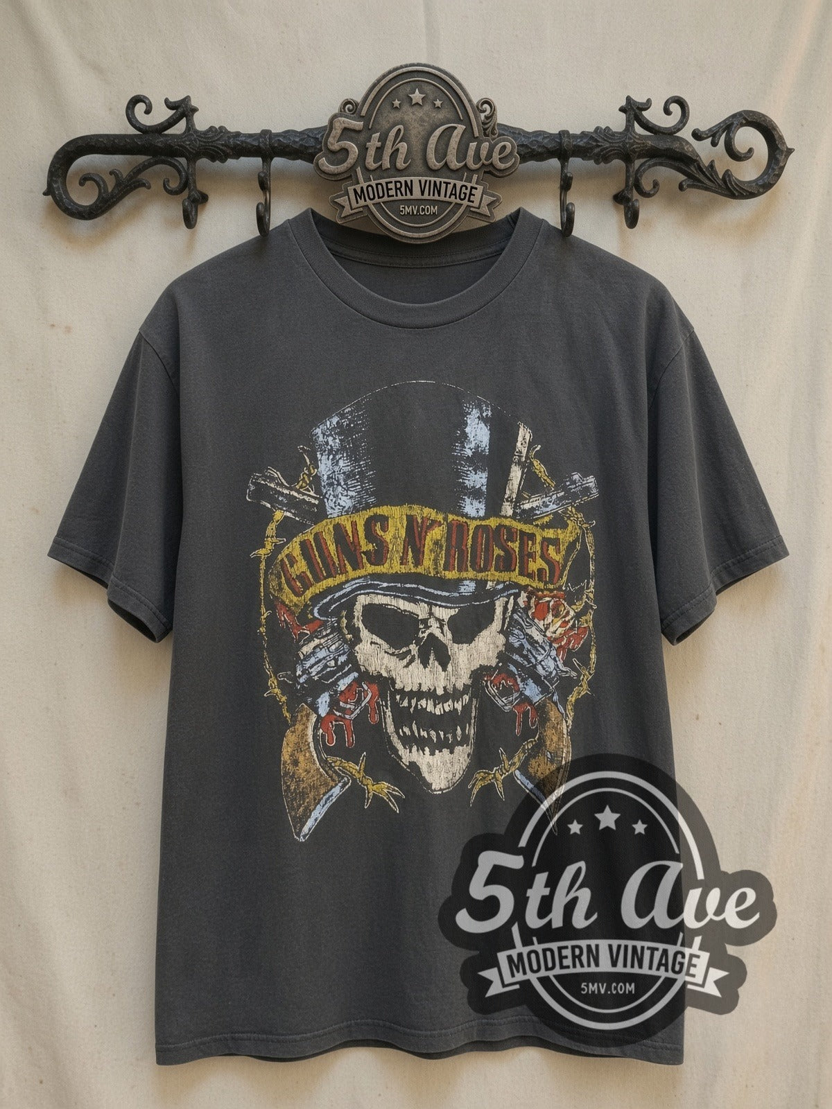 Guns N' Roses 1989 North American Tour vintage band t-shirt, front view on a display rack