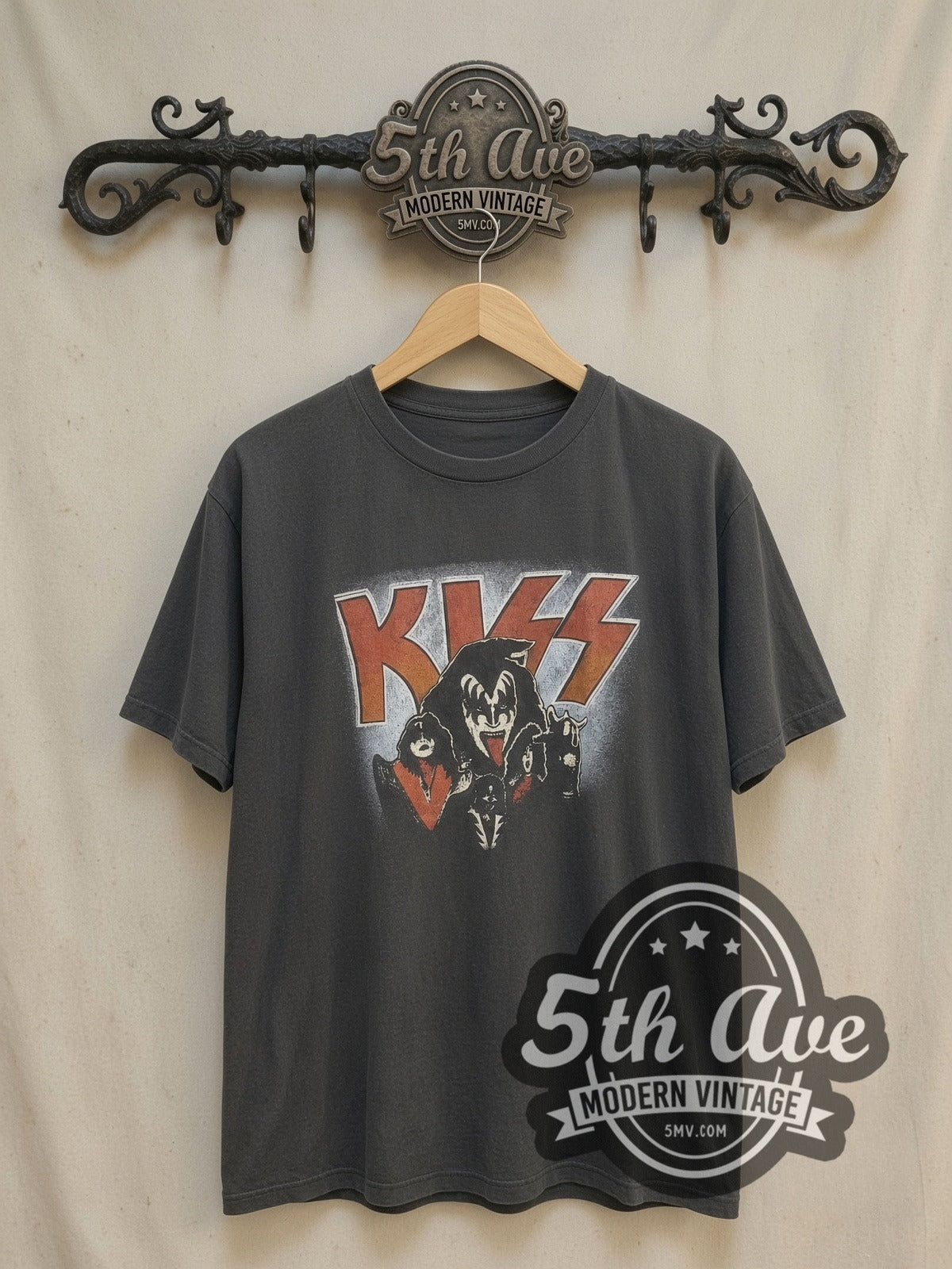 KISS Demon Logo vintage band t-shirt, front view on a display rack