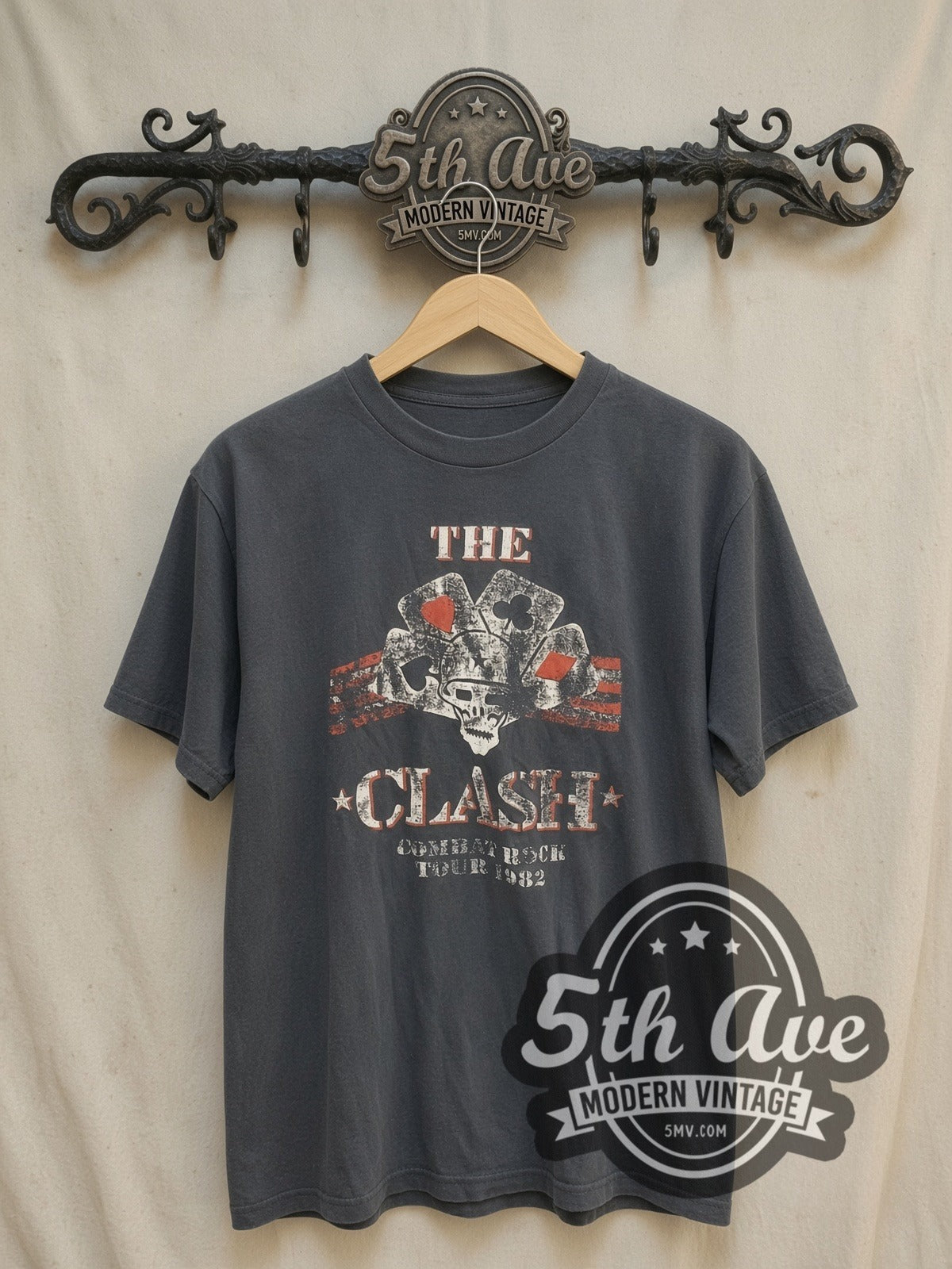 The Clash vintage band t-shirt, front view on a display rack