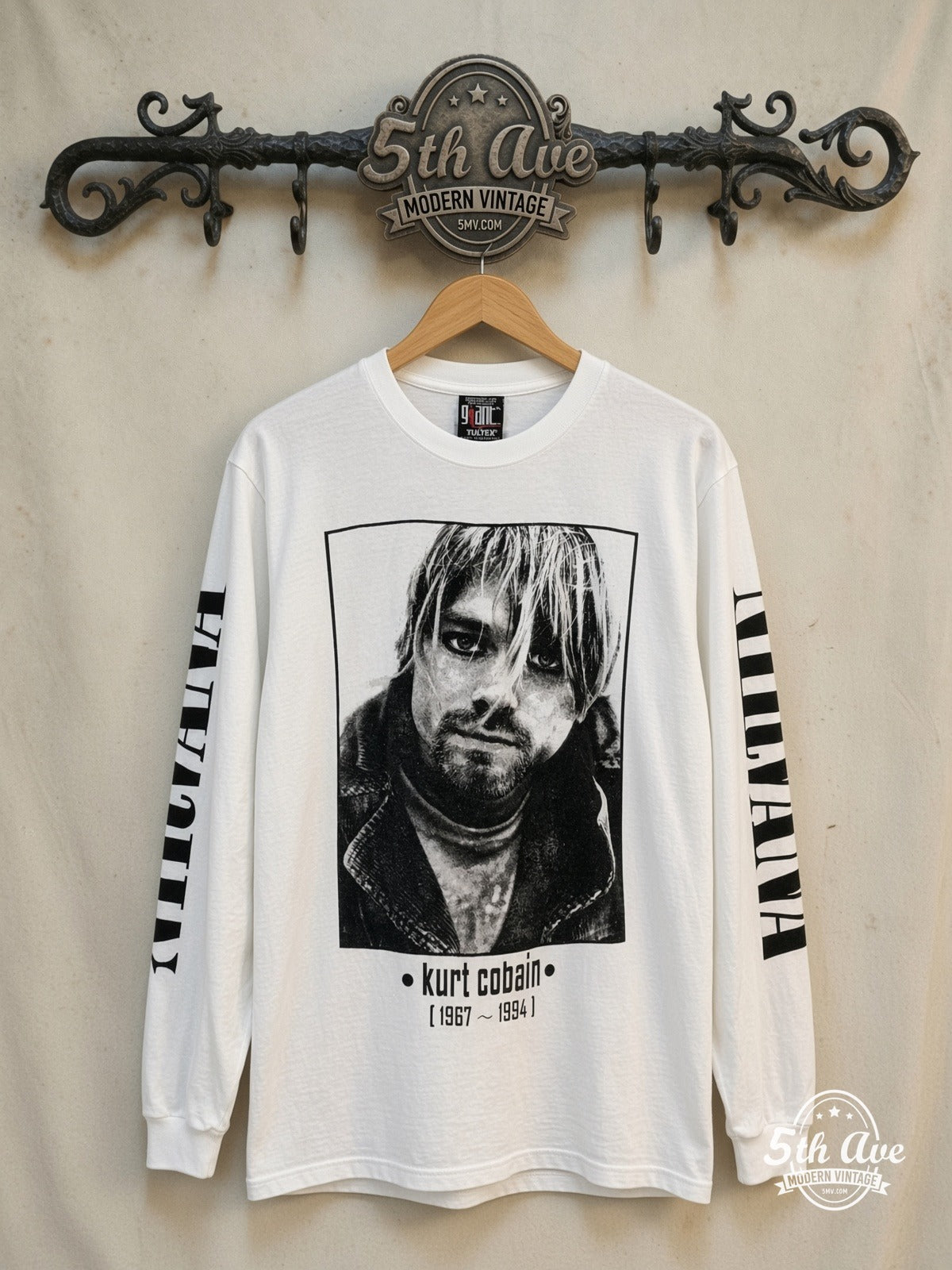 Nirvana – Kurt Cobain 1967-1994 Portrait Long Sleeve – Vintage Band T-Shirt — front on locked cream ornate 5th Ave rack