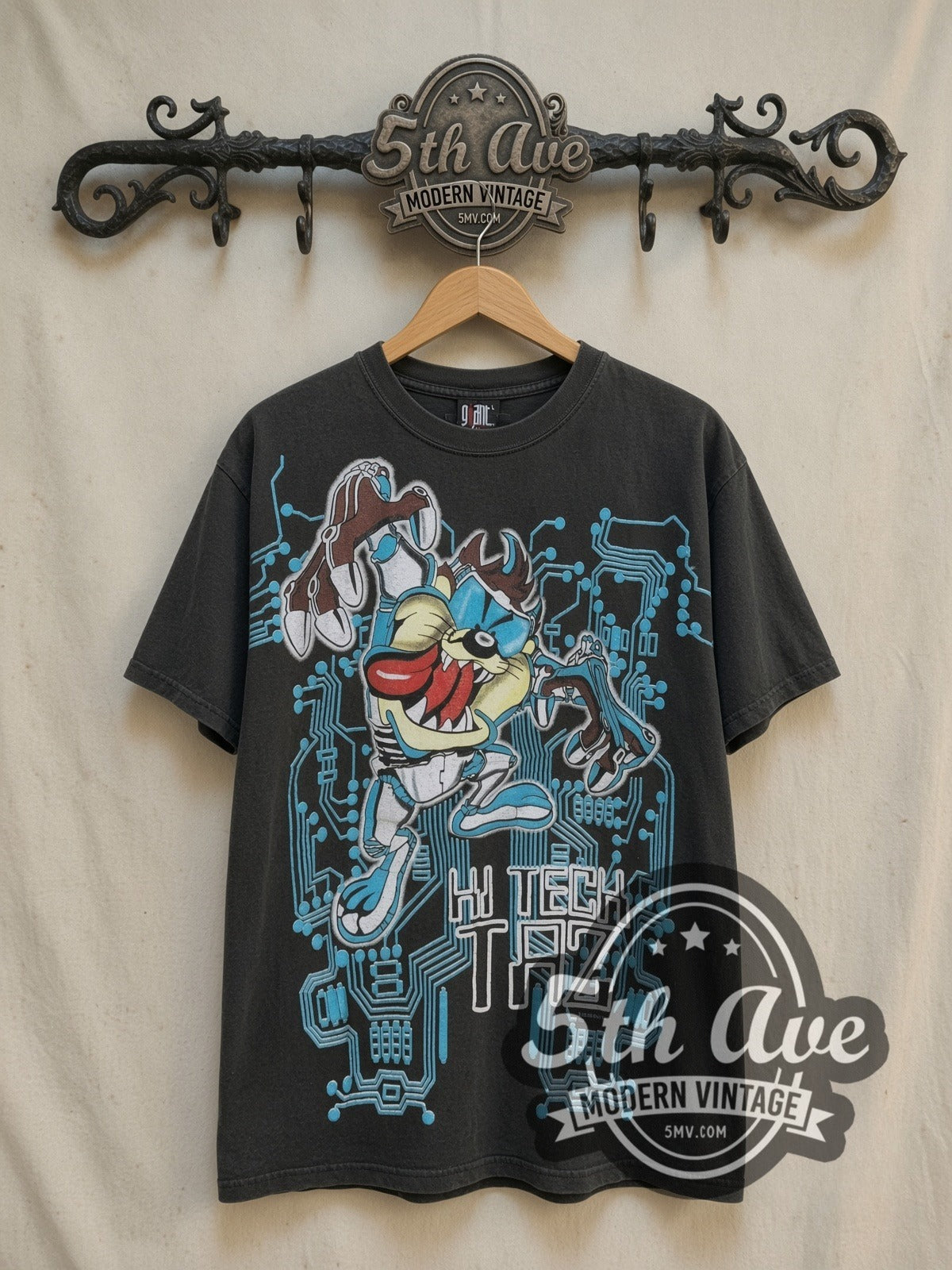 Looney Tunes Taz-Mania Hi-Tech Taz all-over-print vintage cartoon tee, front view on a display rack