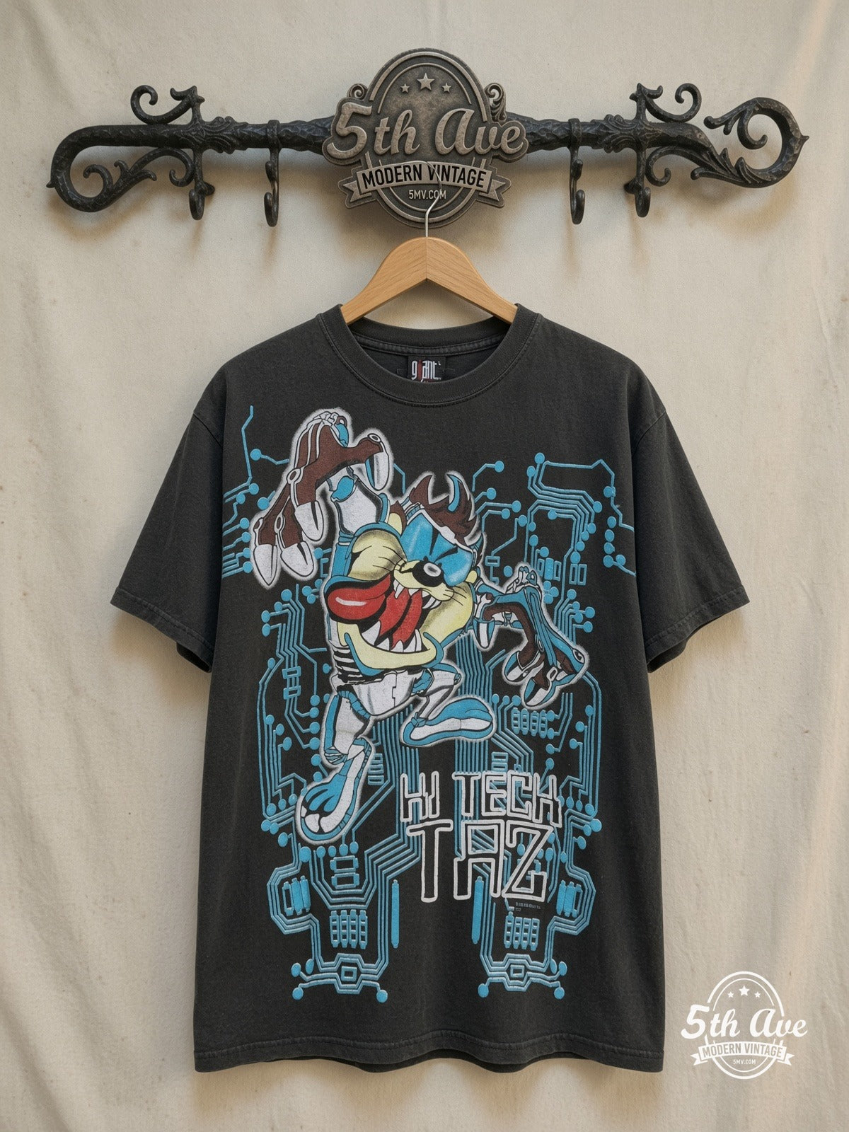 Looney Tunes – Taz-Mania Hi-Tech Taz – All Over Print – New Vintage Graphic Tee — front on locked cream ornate 5th Ave rack