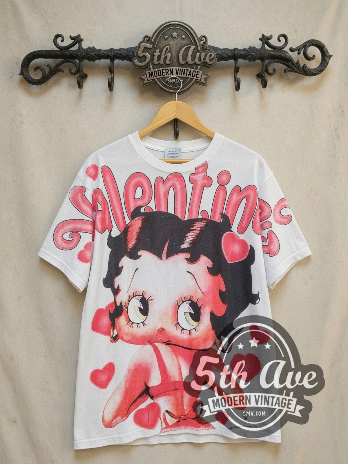 Betty Boop Valentine all-over-print vintage cartoon tee, front view on a display rack