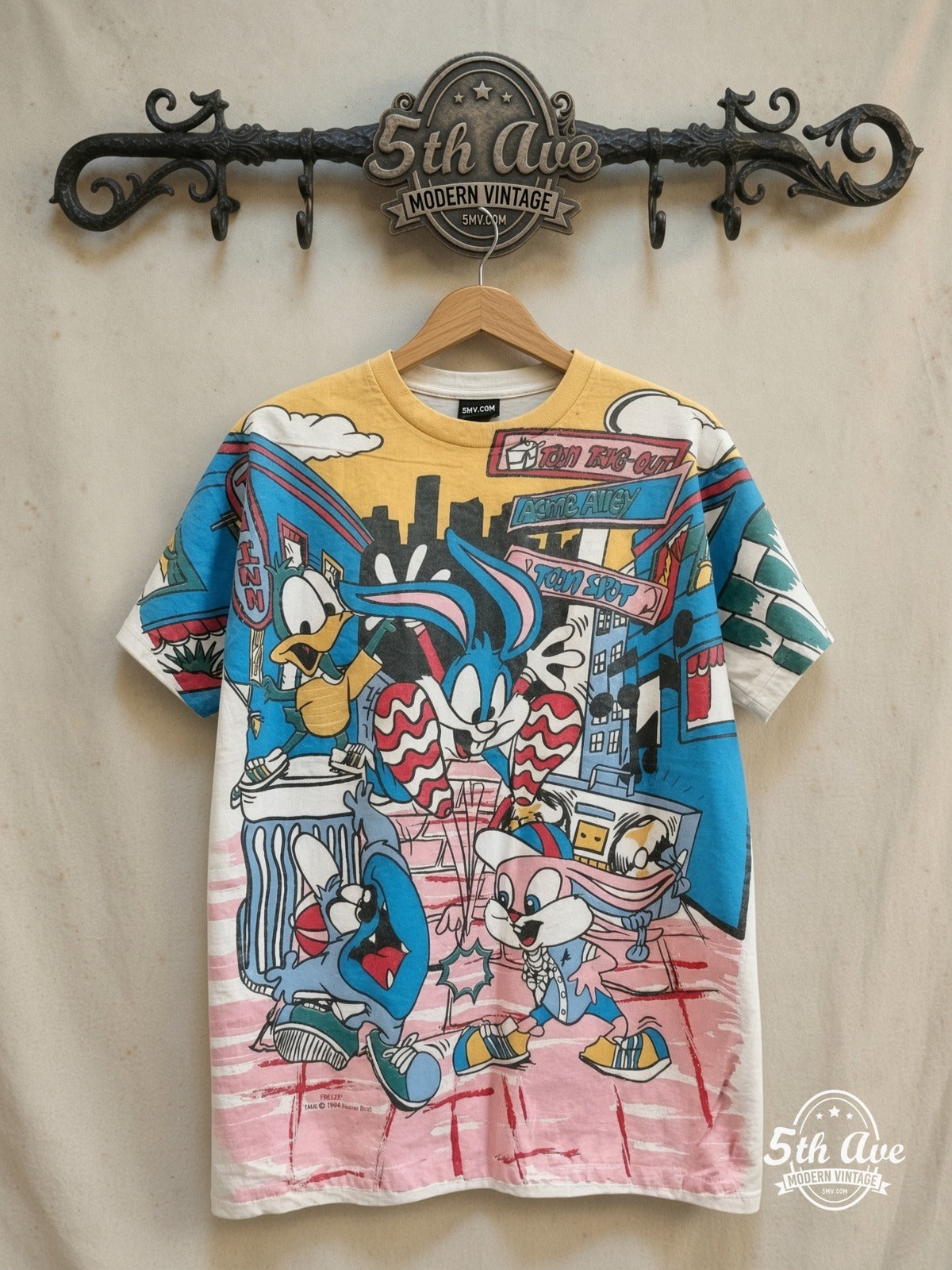 Looney Tunes – All Over Print T-Shirt – New Vintage Graphic Tee — front on locked cream ornate 5th Ave rack