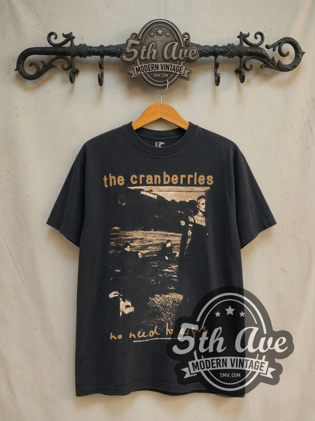 The Cranberries No Need to Argue World Tour 1995 vintage band t-shirt in black, front view on a display rack