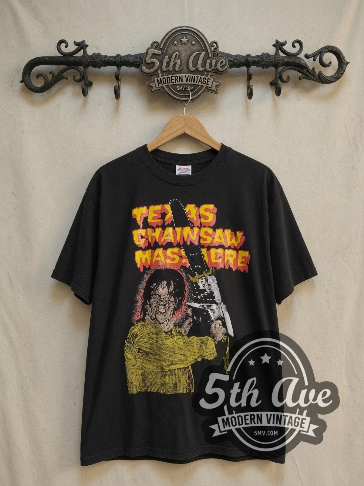 Texas Chainsaw Massacre vintage graphic t-shirt, front view on a display rack