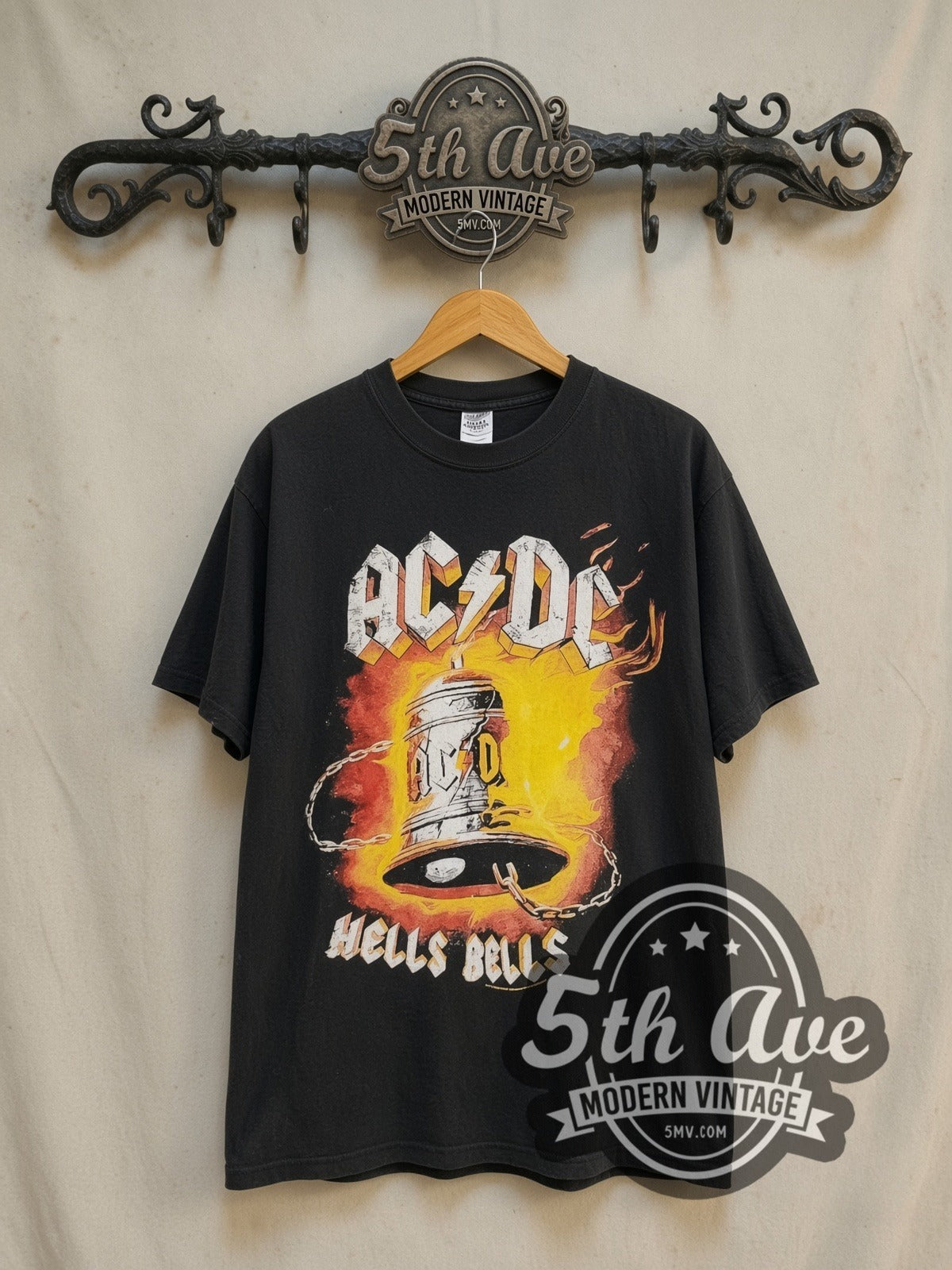 AC/DC Hells Bells Power Up Tour vintage band t-shirt in black, front view on a display rack