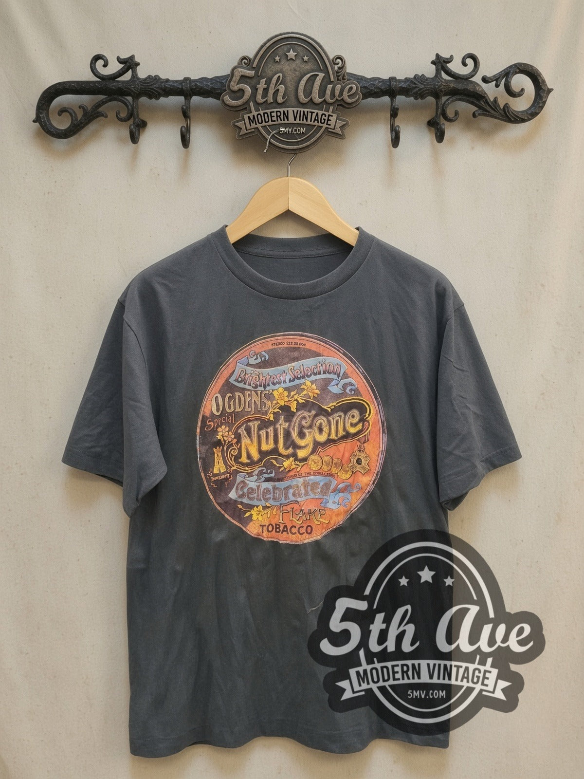 Woodstock Nut Gone vintage band t-shirt, front view on a display rack