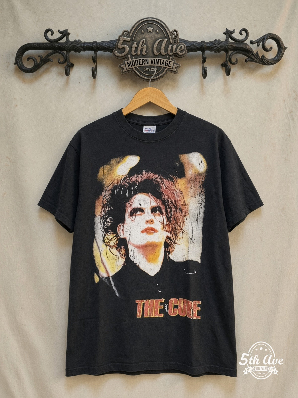 The Cure – Greatest Hits – Vintage Band T-Shirt — front on locked cream ornate 5th Ave rack