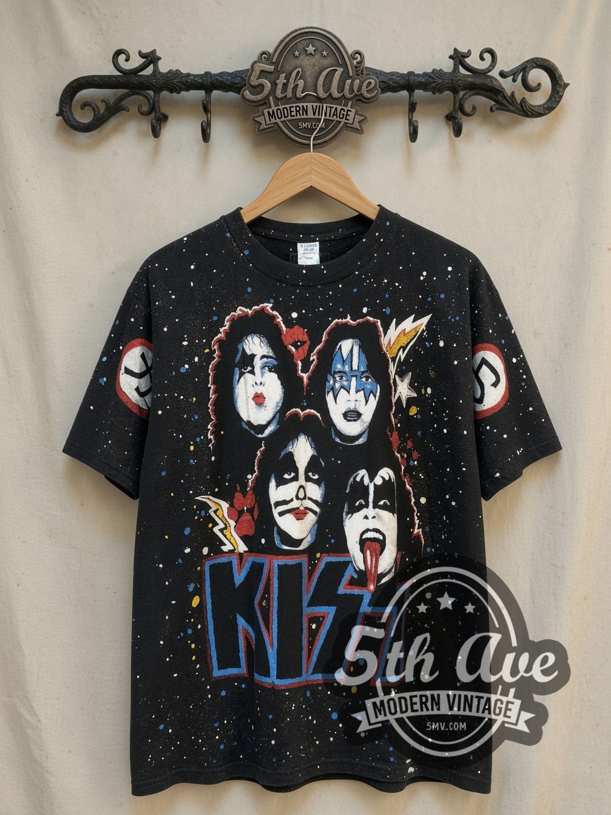 KISS KIϟϟ all-over-print vintage band t-shirt, front view on a display rack