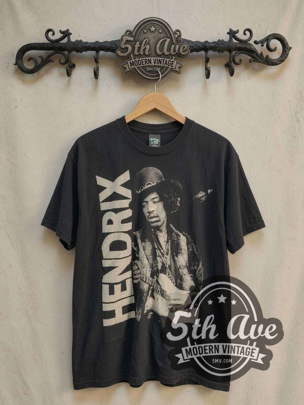 Jimi Hendrix Hat Guitar Portrait Vertical Name vintage band t-shirt, front view on a display rack