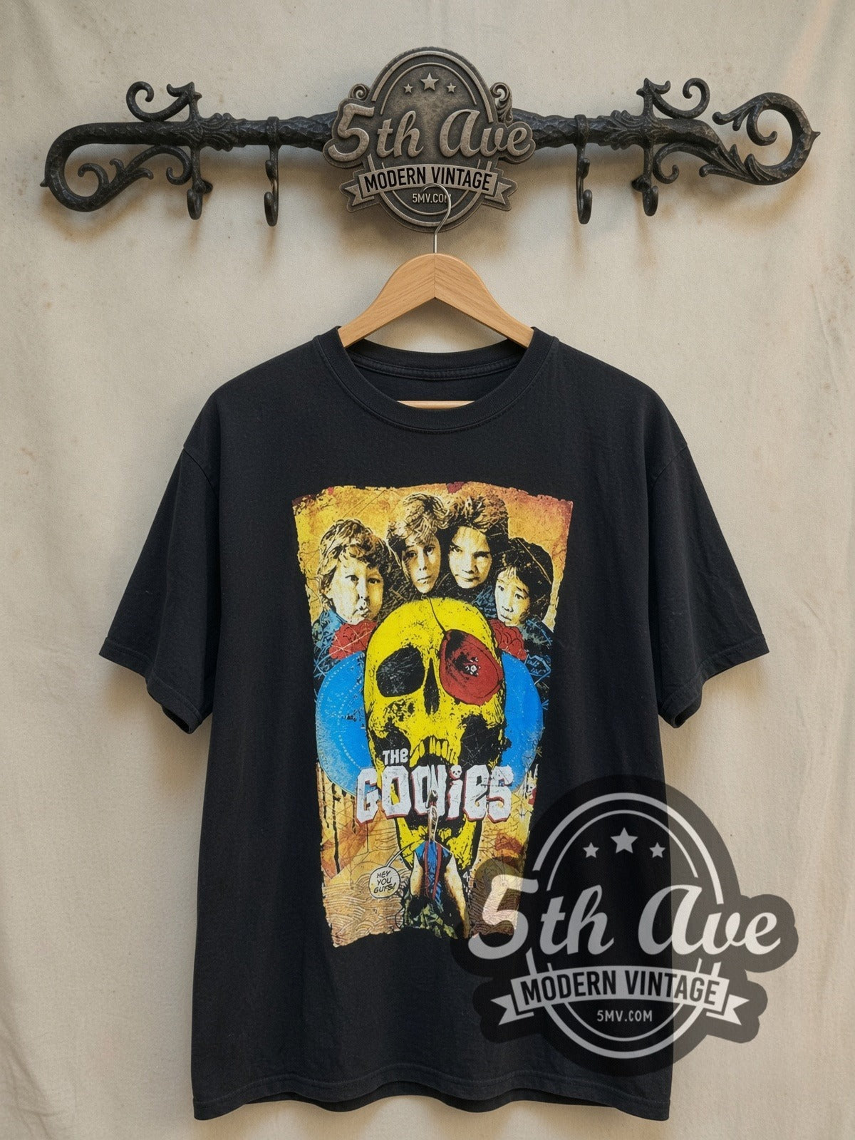 The Goonies vintage movie t-shirt, front view on a display rack