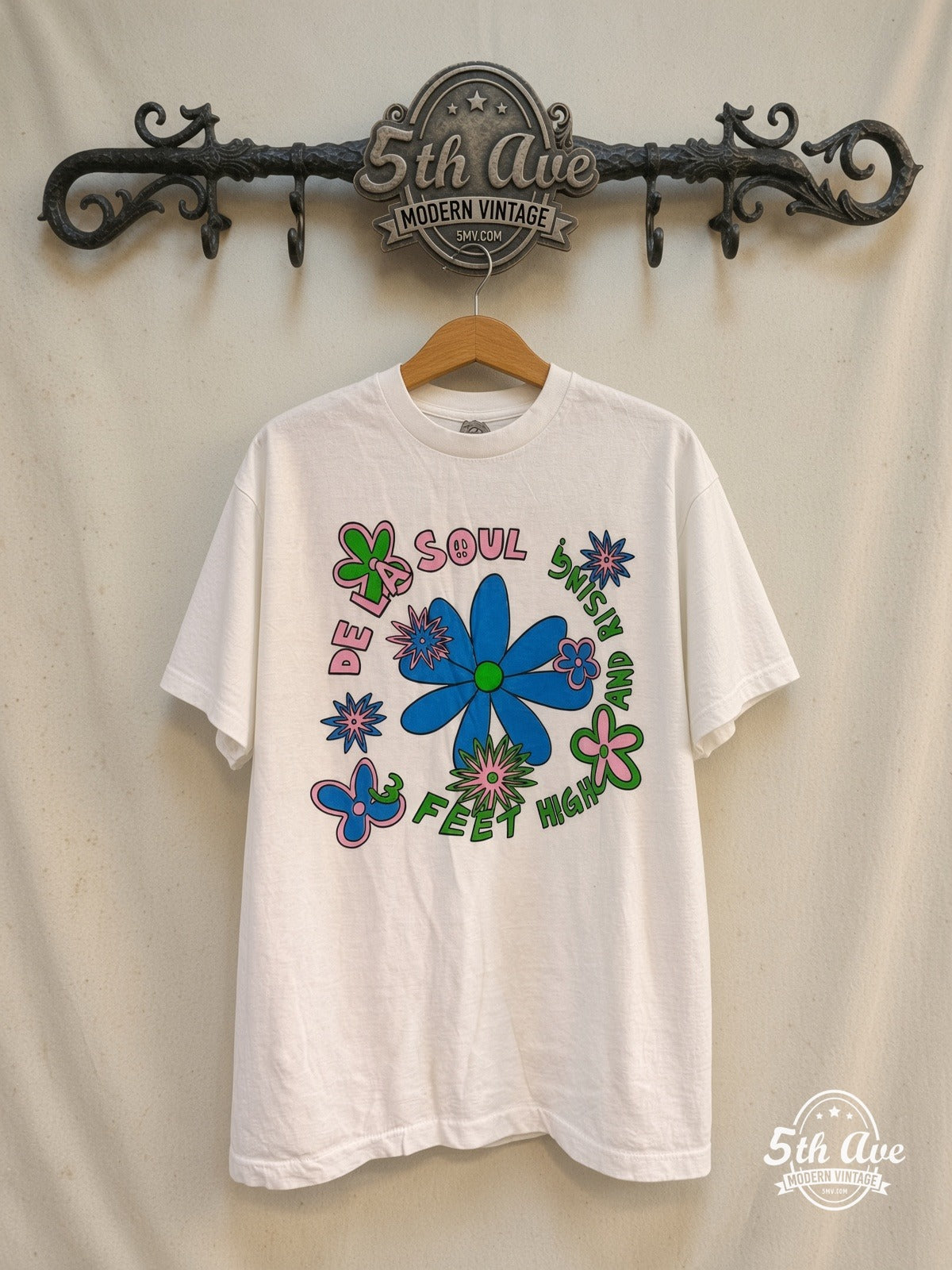 De La Soul – 3 Feet High and Rising – Vintage Band T-Shirt — front on locked cream ornate 5th Ave rack