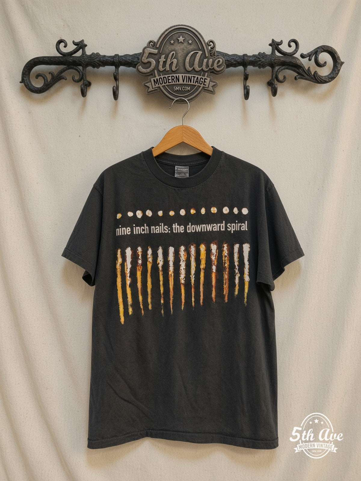 Nine Inch Nails – The Downward Spiral – Vintage Band T-Shirt — front on locked cream ornate 5th Ave rack