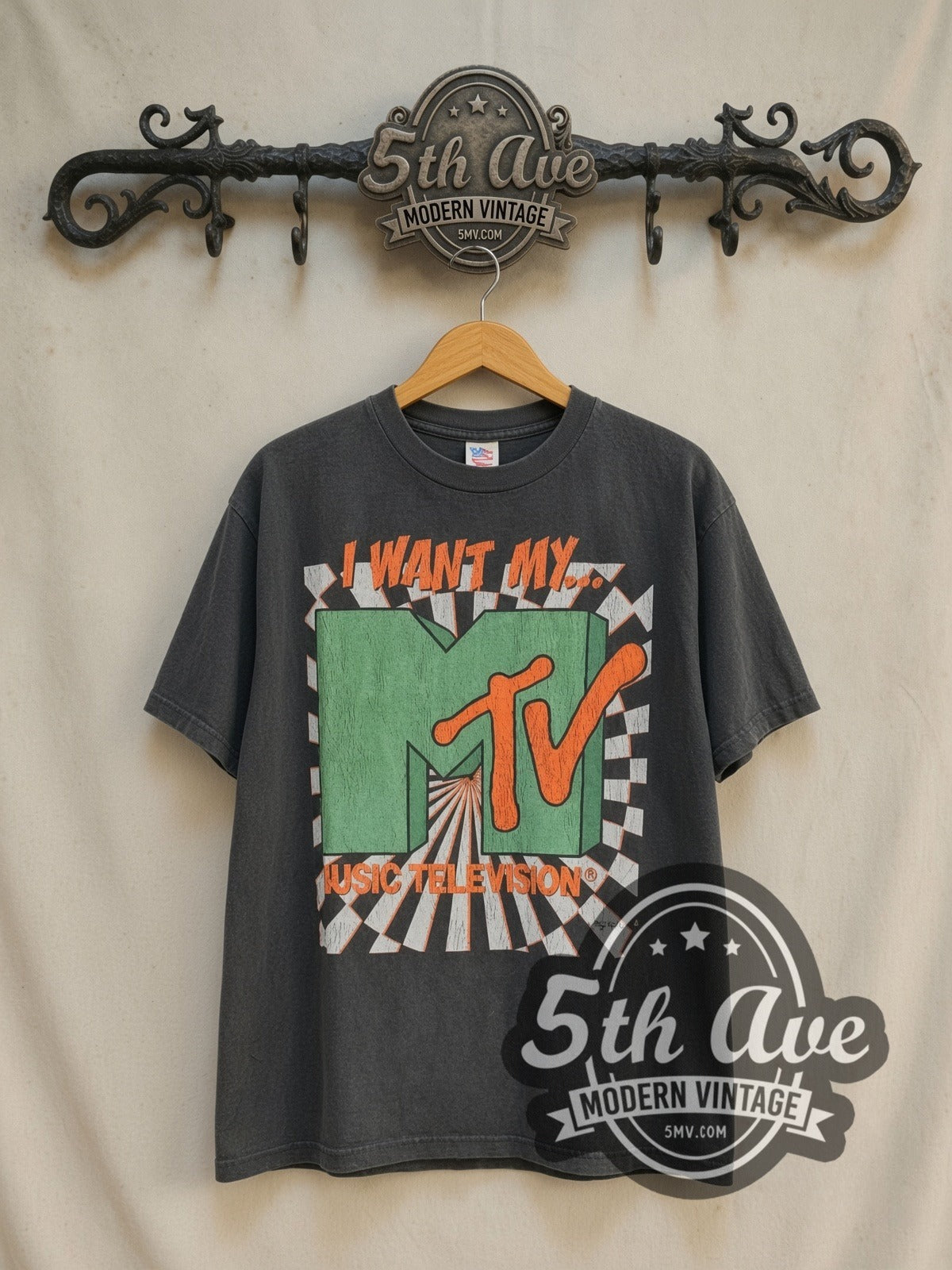 MTV I Want My MTV vintage graphic tee in black, front view on a display rack