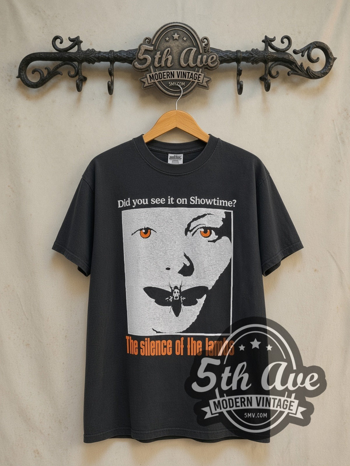 The Silence of the Lambs Showtime vintage graphic t-shirt, front view on a display rack