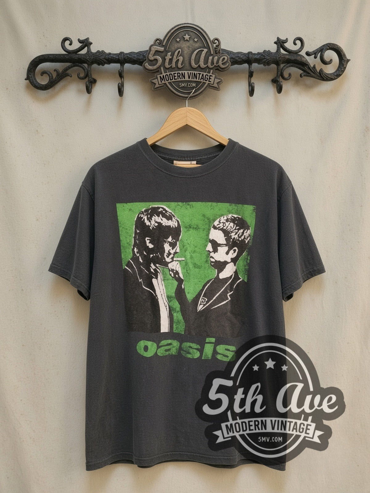 Oasis Gallagher Brothers vintage band t-shirt, front view on a display rack