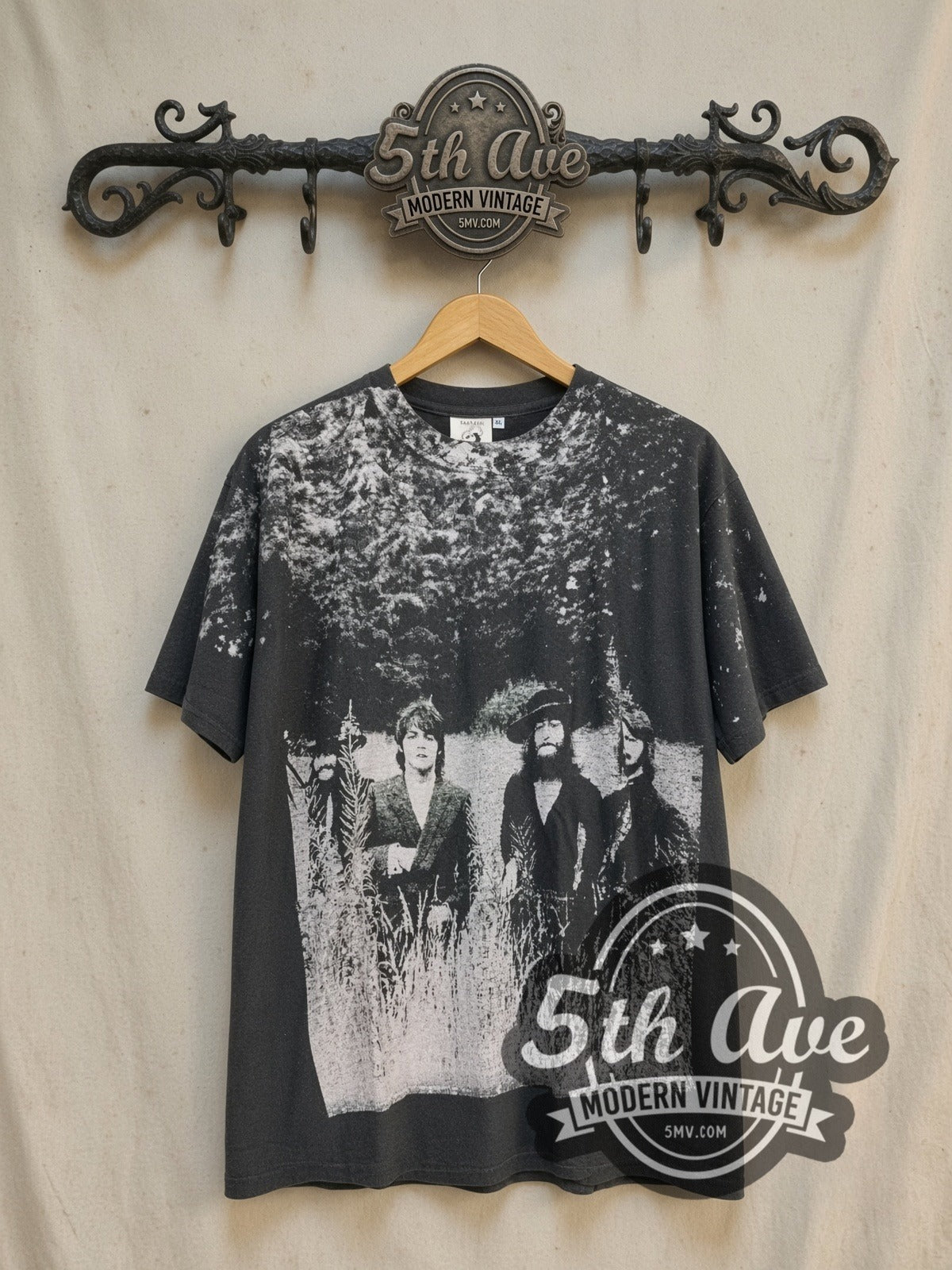 The Beatles Field Portrait Bleached Shoulders vintage band t-shirt, front view on a display rack