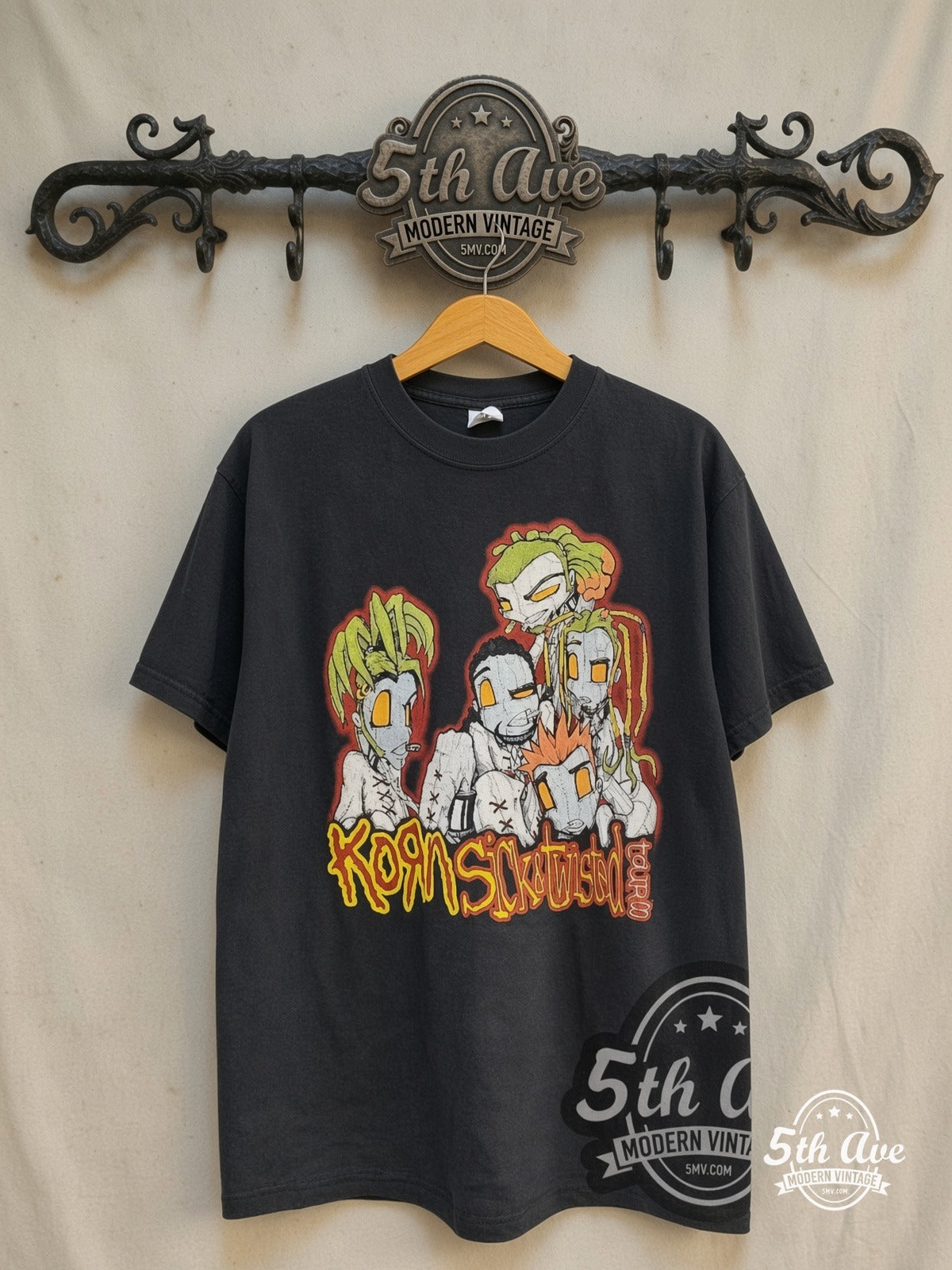 Korn – Sick and Twisted Cartoon City List – Vintage Band T-Shirt — front on locked cream ornate 5th Ave rack