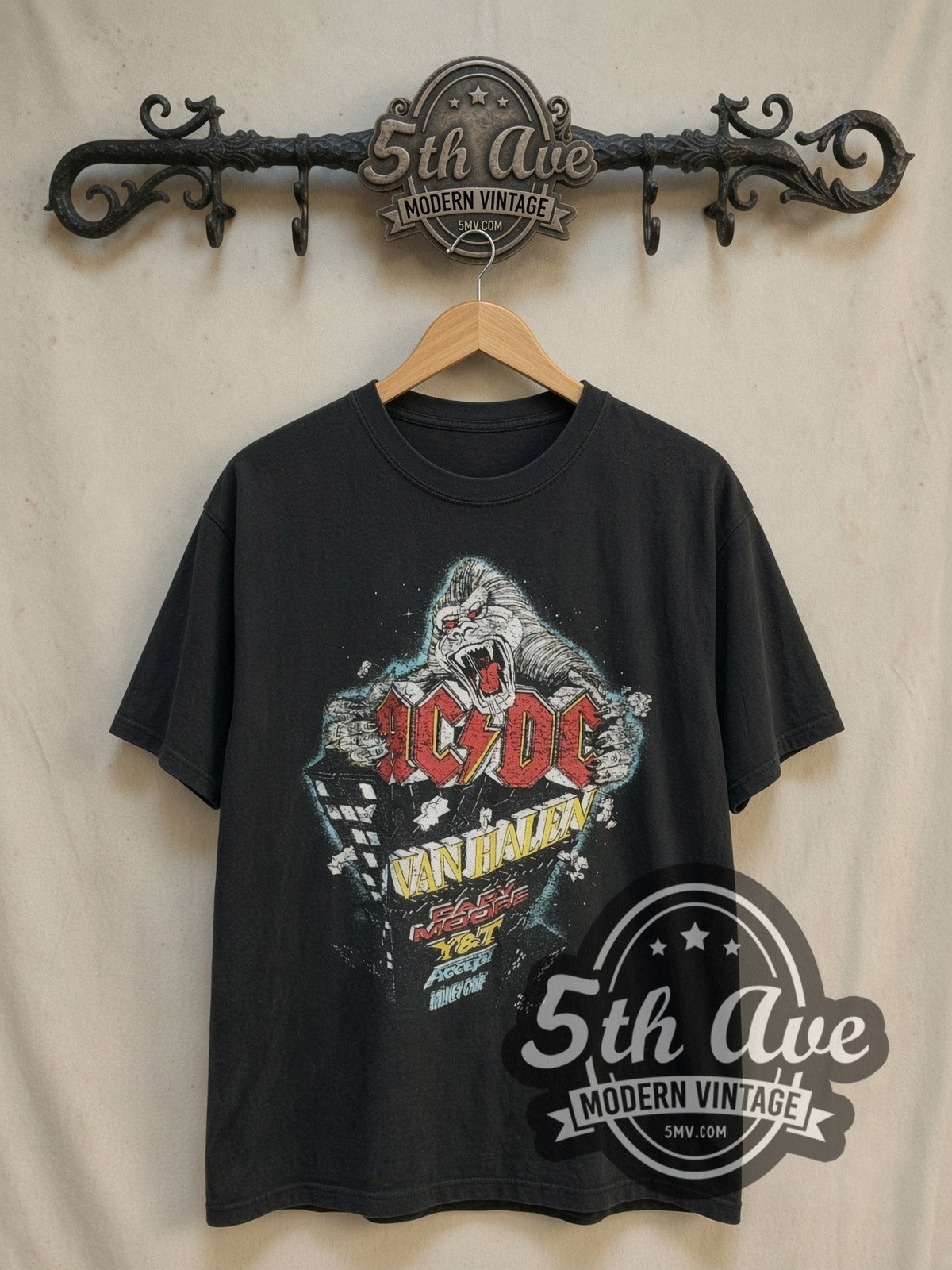 Mötley Crüe Monsters of Rock 1984 vintage band t-shirt, front view on a display rack