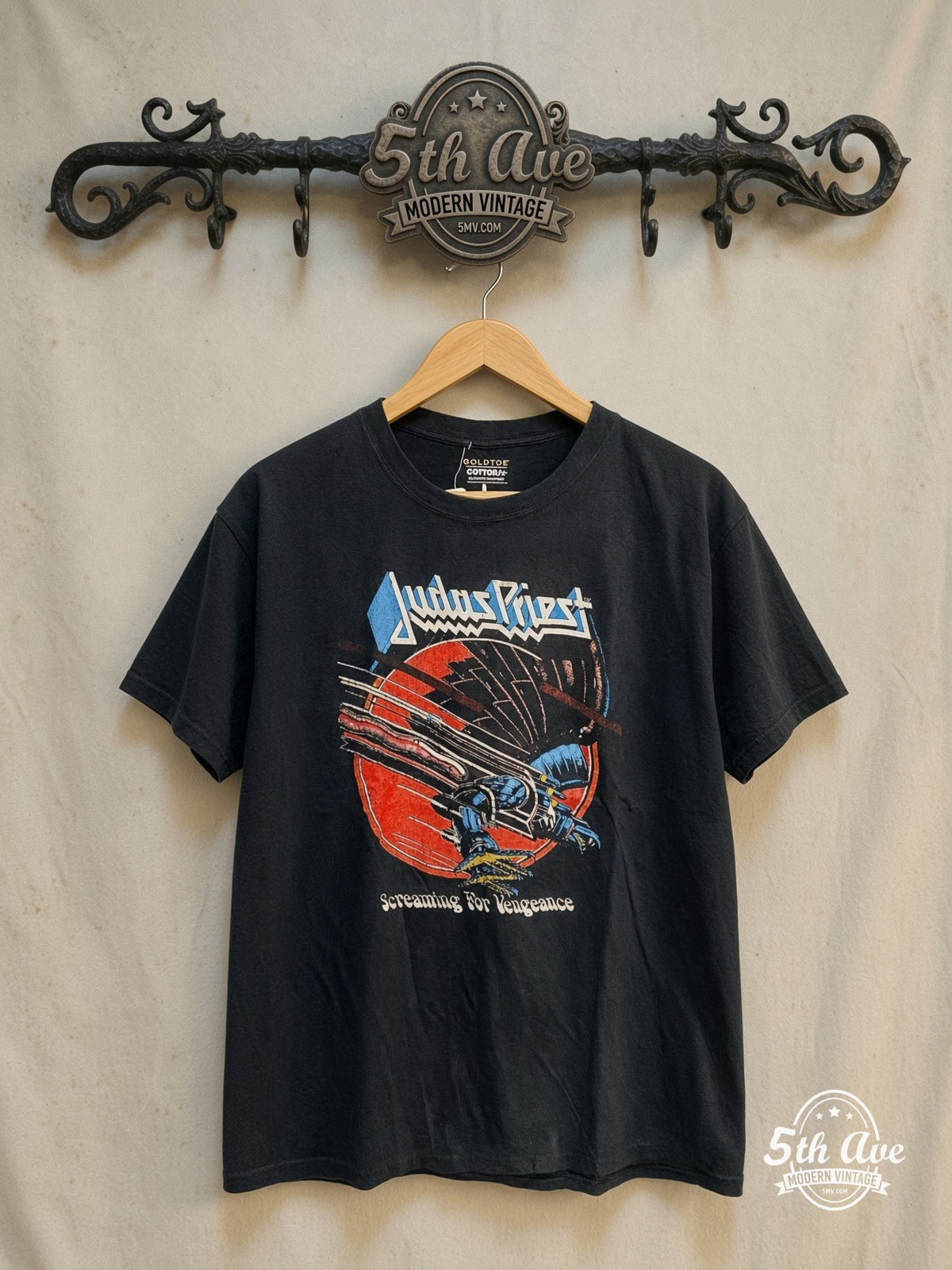 Judas Priest – World Tour 1982-83 – Vintage Band T-Shirt — front on locked cream ornate 5th Ave rack