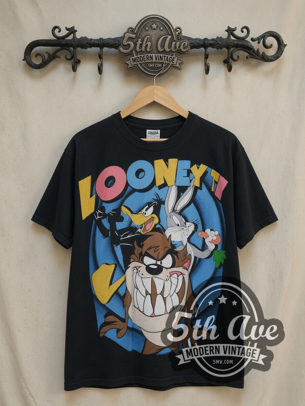 Bugs Bunny Looney Tunes Bugs Bunny Daffy Duck and Taz-Mania vintage cartoon tee, front view on a display rack