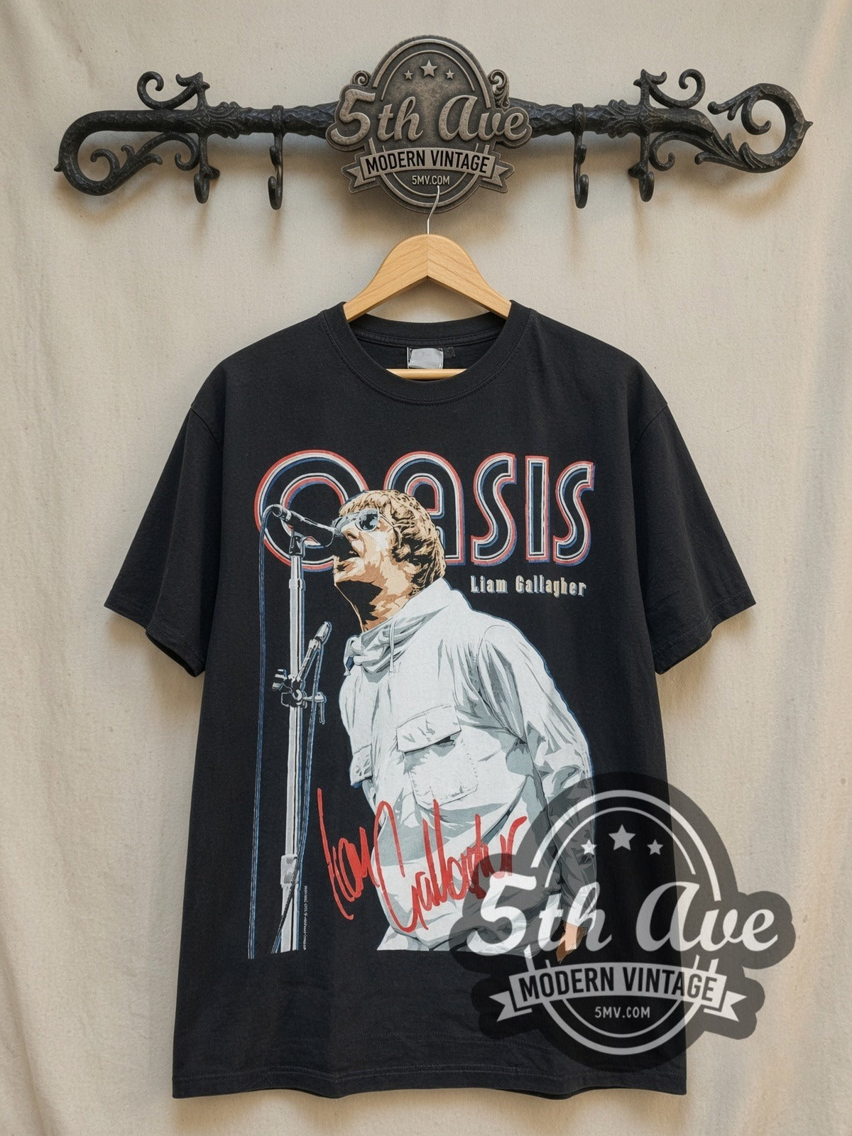 Oasis Liam Gallagher Red Signature vintage band t-shirt, front view on a display rack