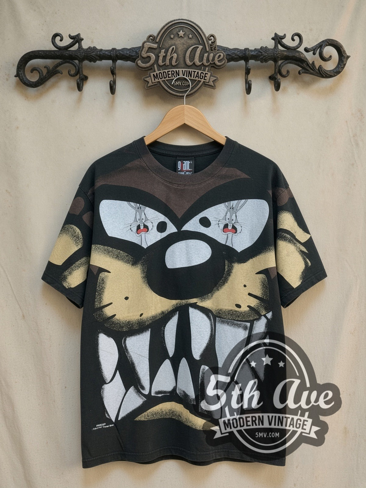 Bugs Bunny Taz-Mania and Bugs Bunny all-over-print vintage cartoon tee, front view on a display rack