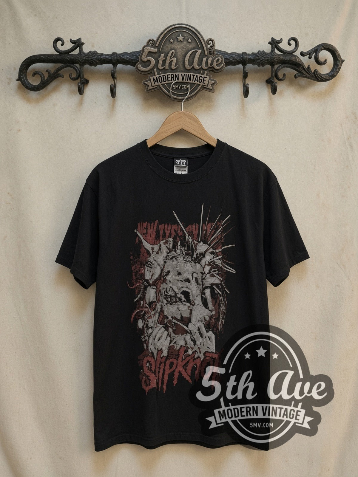 Slipknot Unleash the Madness vintage band t-shirt, front view on a display rack