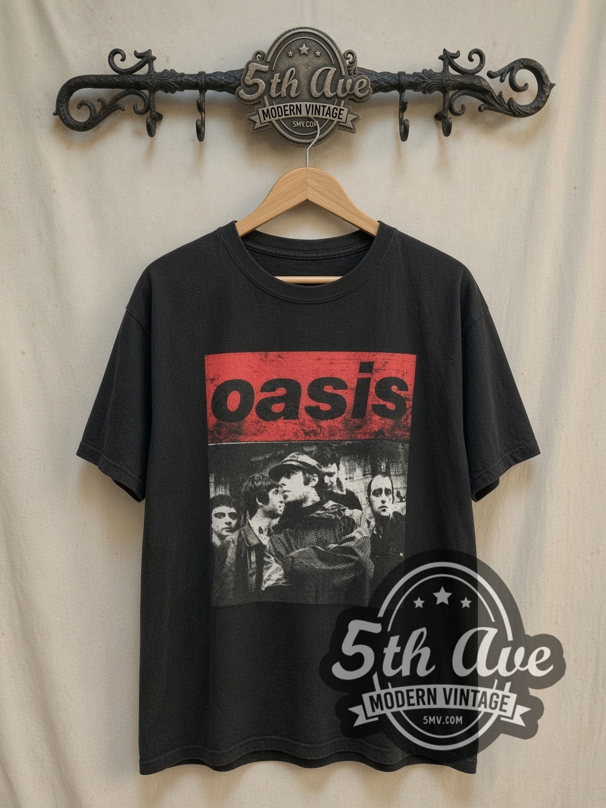 Oasis Band Image vintage band t-shirt, front view on a display rack