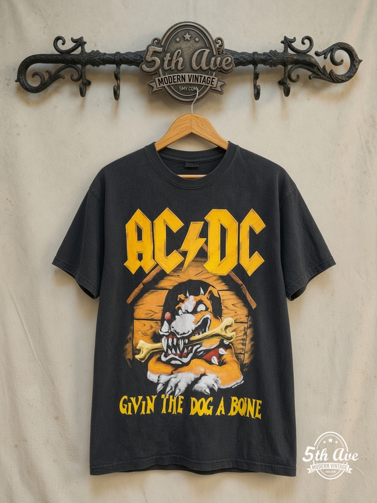 AC/DC – Givin the Dog a Bone World Tour 1993 – Vintage Band T-Shirt — front on locked cream ornate 5th Ave rack