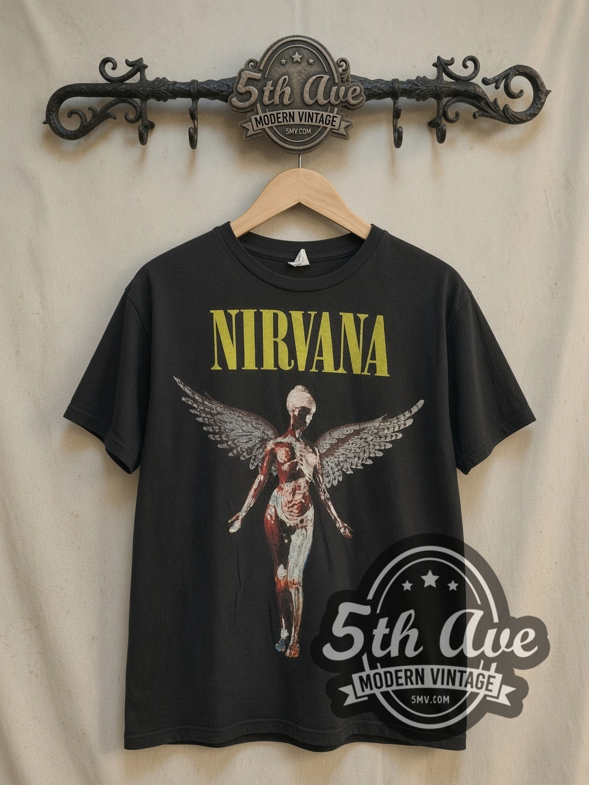 Nirvana In Utero Angel with Back Print vintage band t-shirt, front view on a display rack