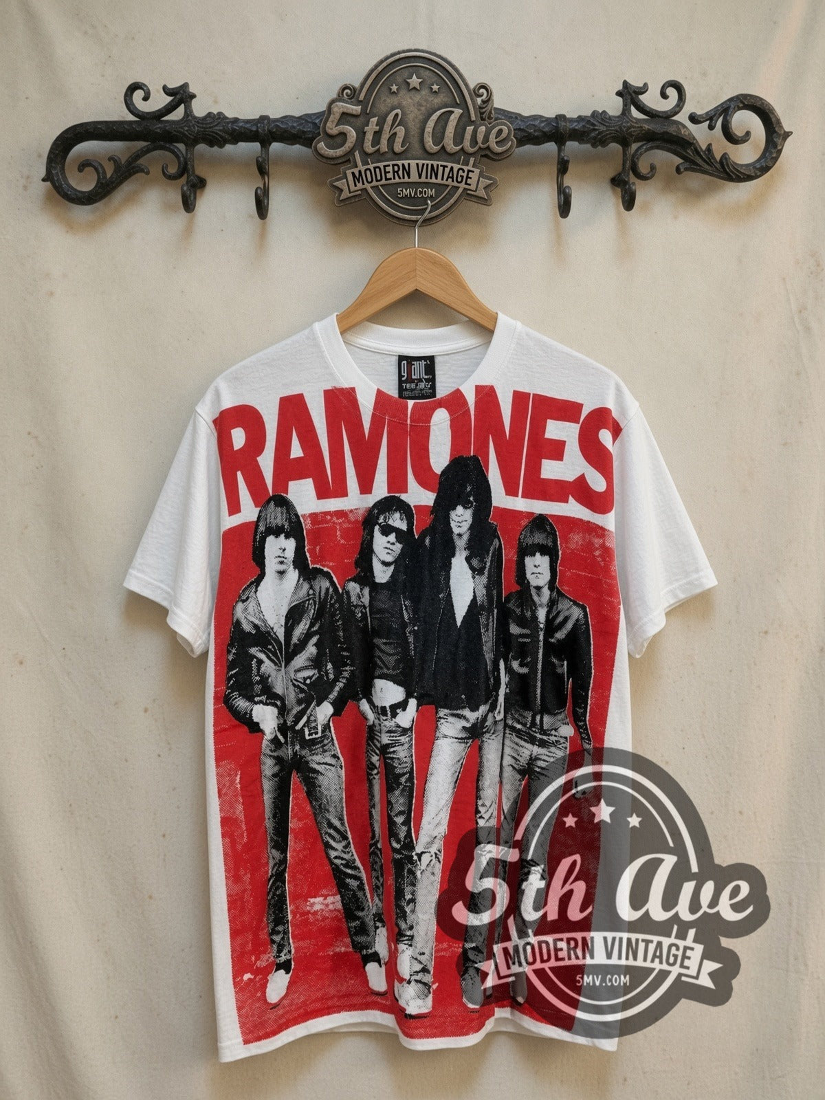 The Ramones Red Band Photo all-over-print vintage band t-shirt in white, front view on a display rack