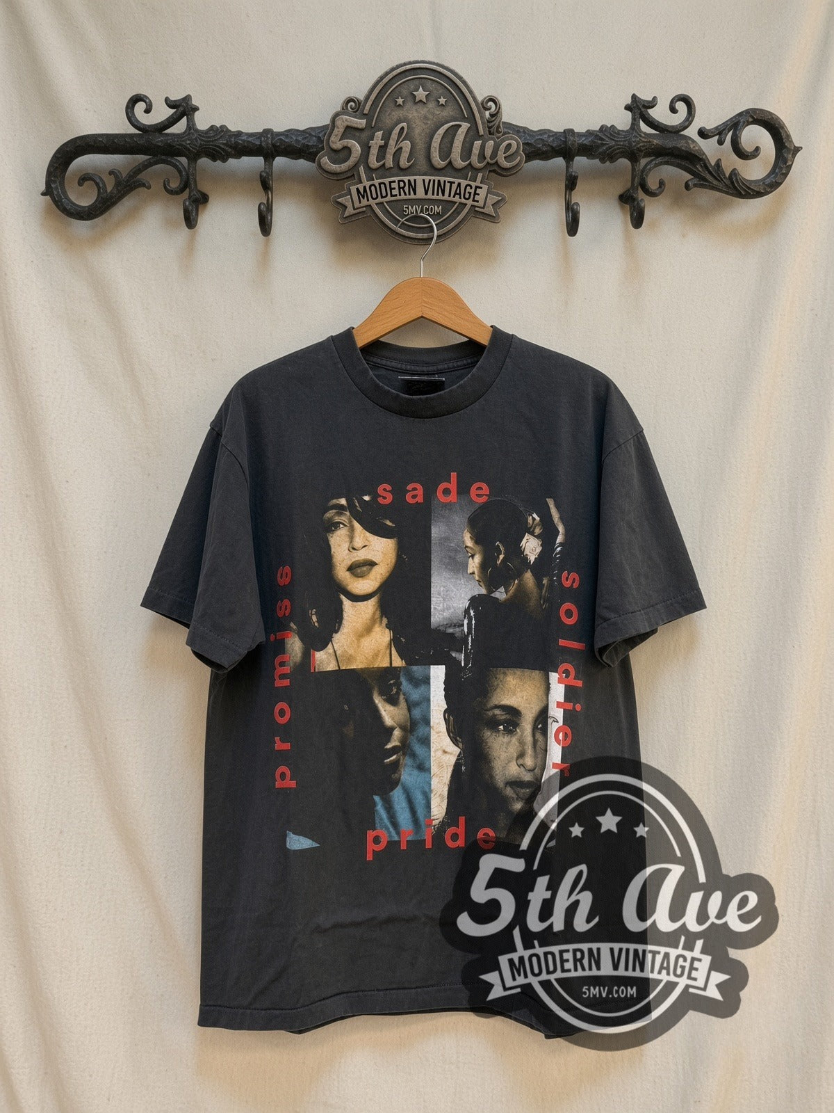 Sade Promise vintage band t-shirt in black, front view on a display rack