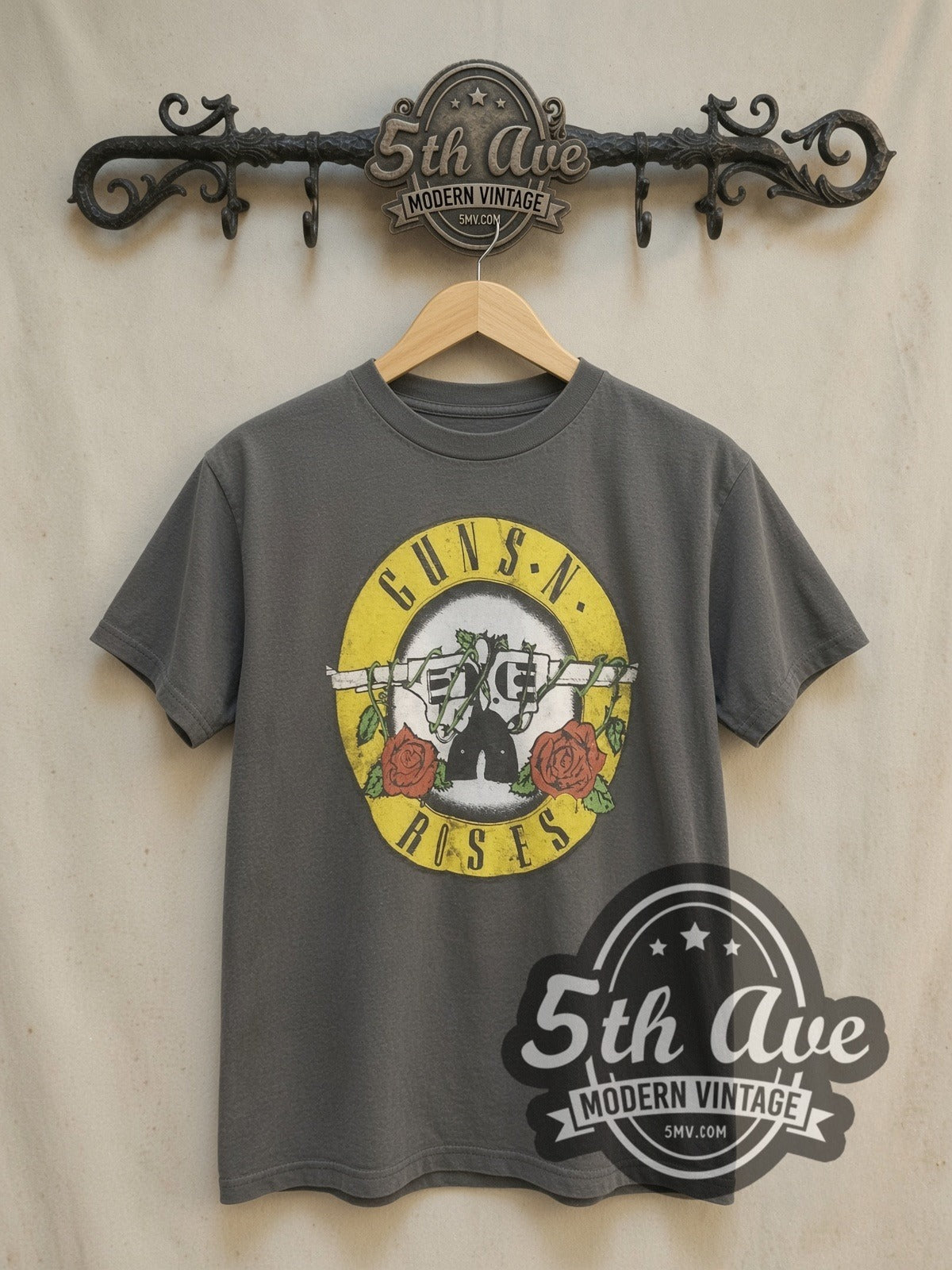 Guns N' Roses Bullet Circle Logo vintage band t-shirt, front view on a display rack