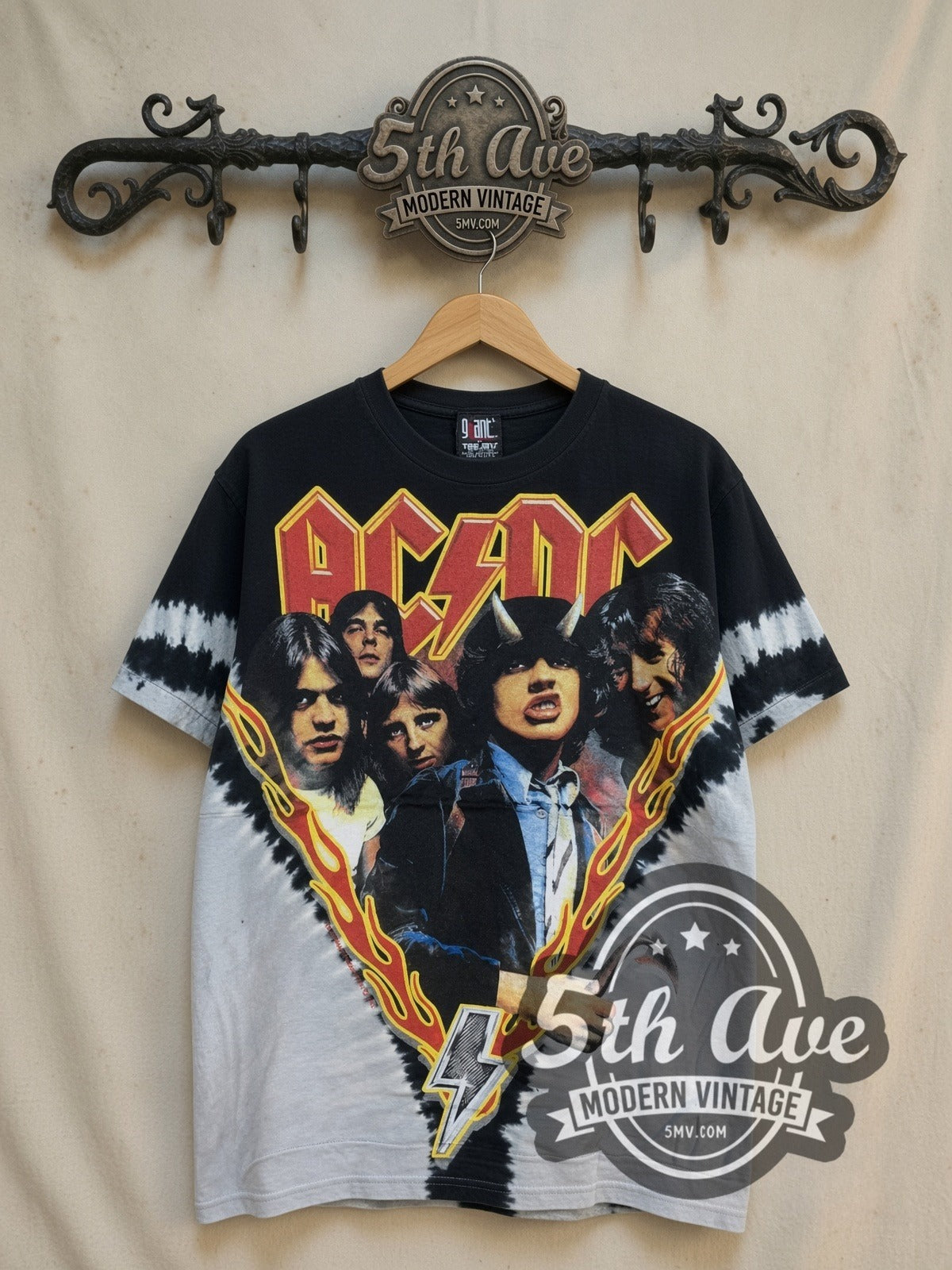 AC/DC Highway to Hell Flame V Black Grey Tie-Dye vintage band t-shirt in black and grey tie-dye, front view on a display rack