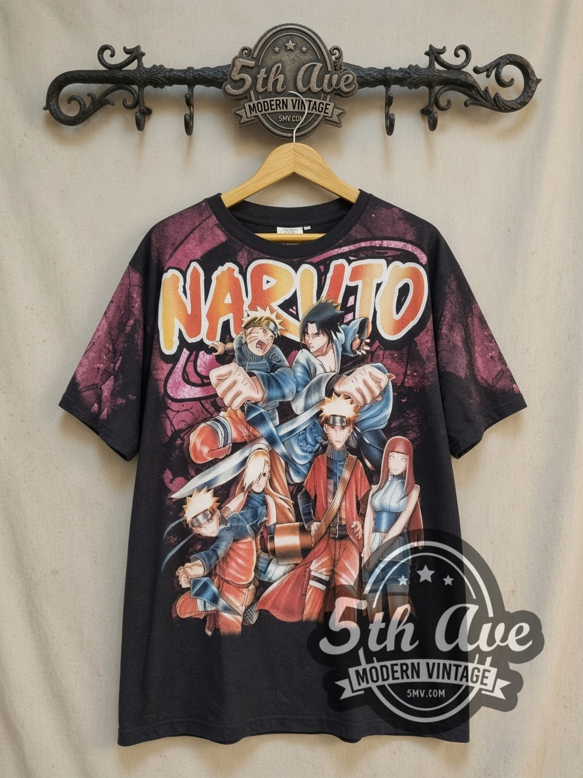 Naruto Shippuden all-over-print vintage graphic t-shirt, front view on a display rack