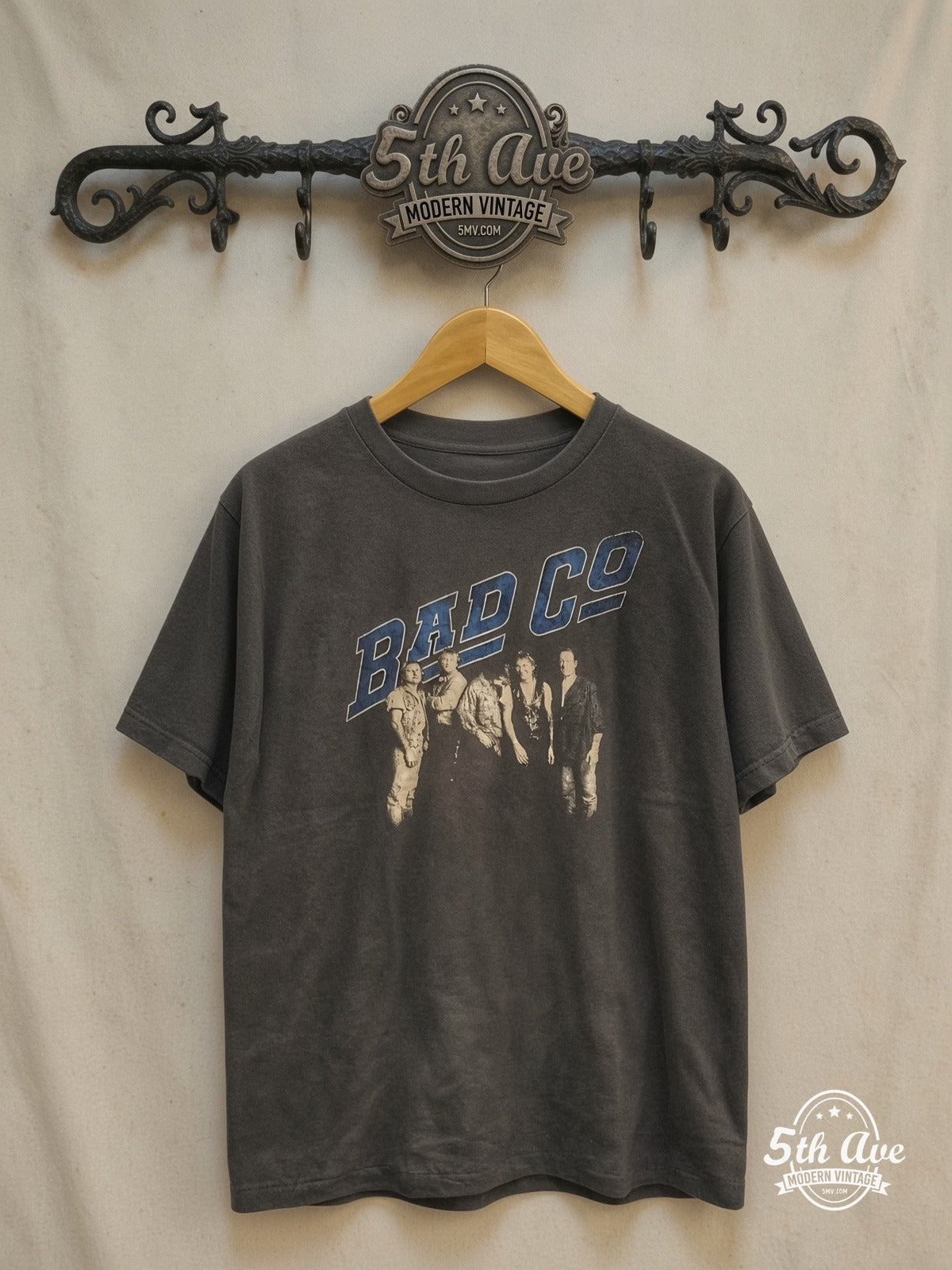 Graphic – Harmonies of History – Vintage Band T-Shirt — front on locked cream ornate 5th Ave rack