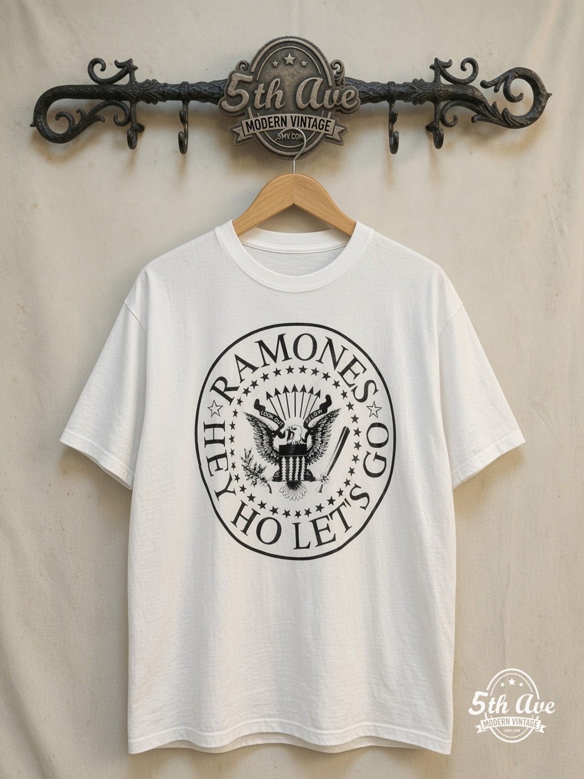 The Ramones – Hey! Ho! Let's Go Anthology – Vintage Band T-Shirt — front on locked cream ornate 5th Ave rack