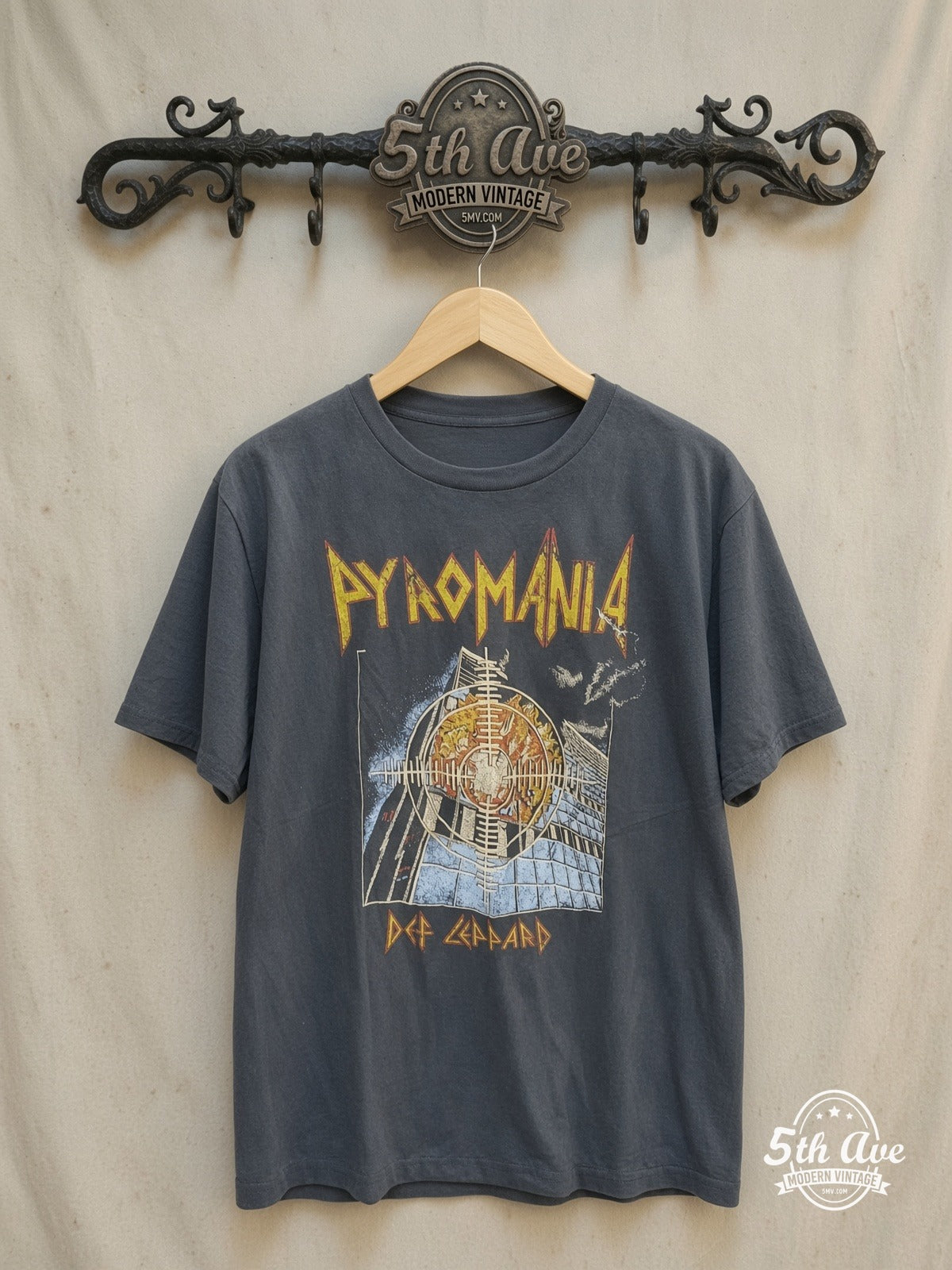 Def Leppard – Pyromania Burning Building Target – Vintage Band T-Shirt — front on locked cream ornate 5th Ave rack