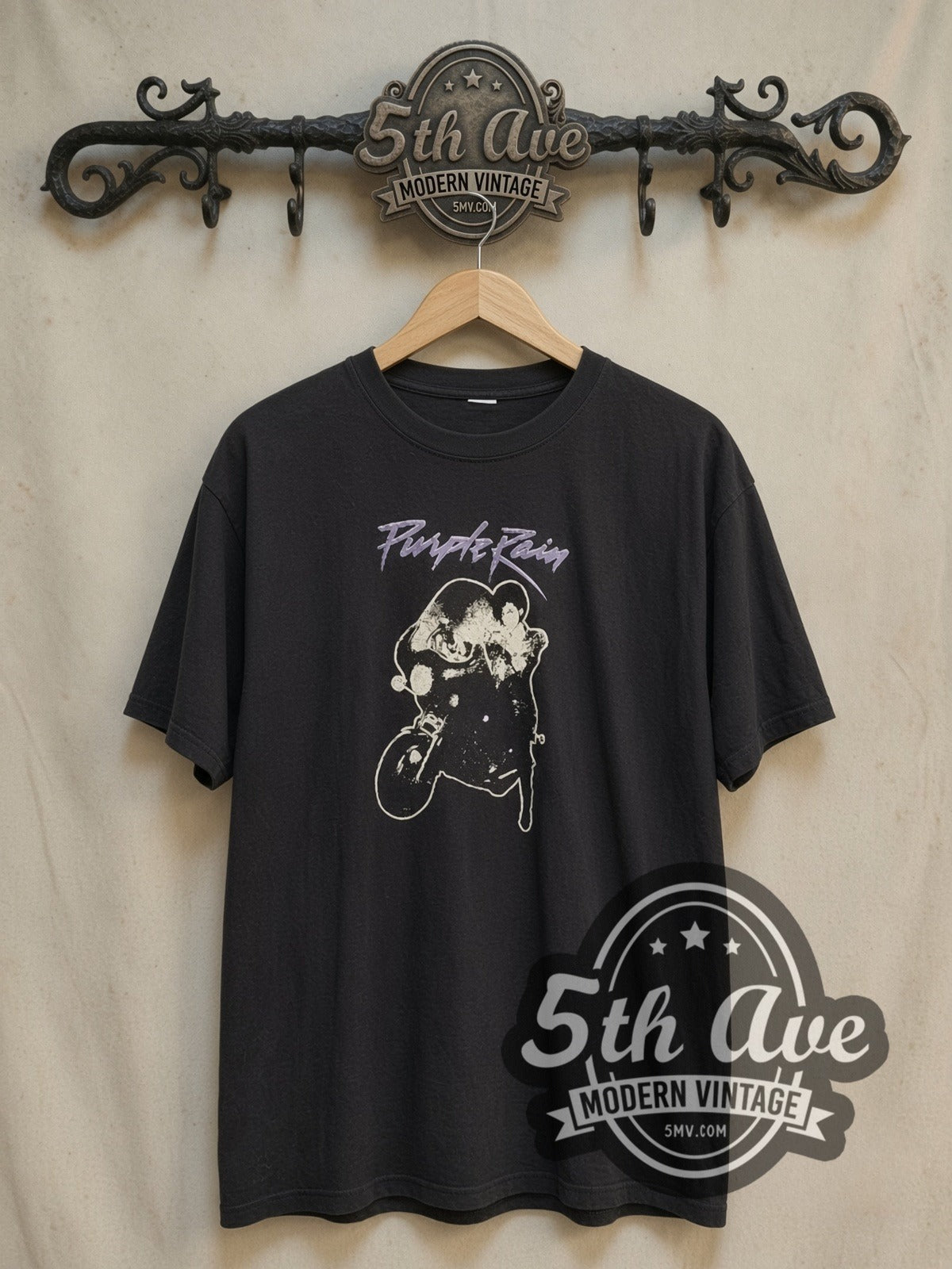 Prince Purple Rain vintage band t-shirt, front view on a display rack