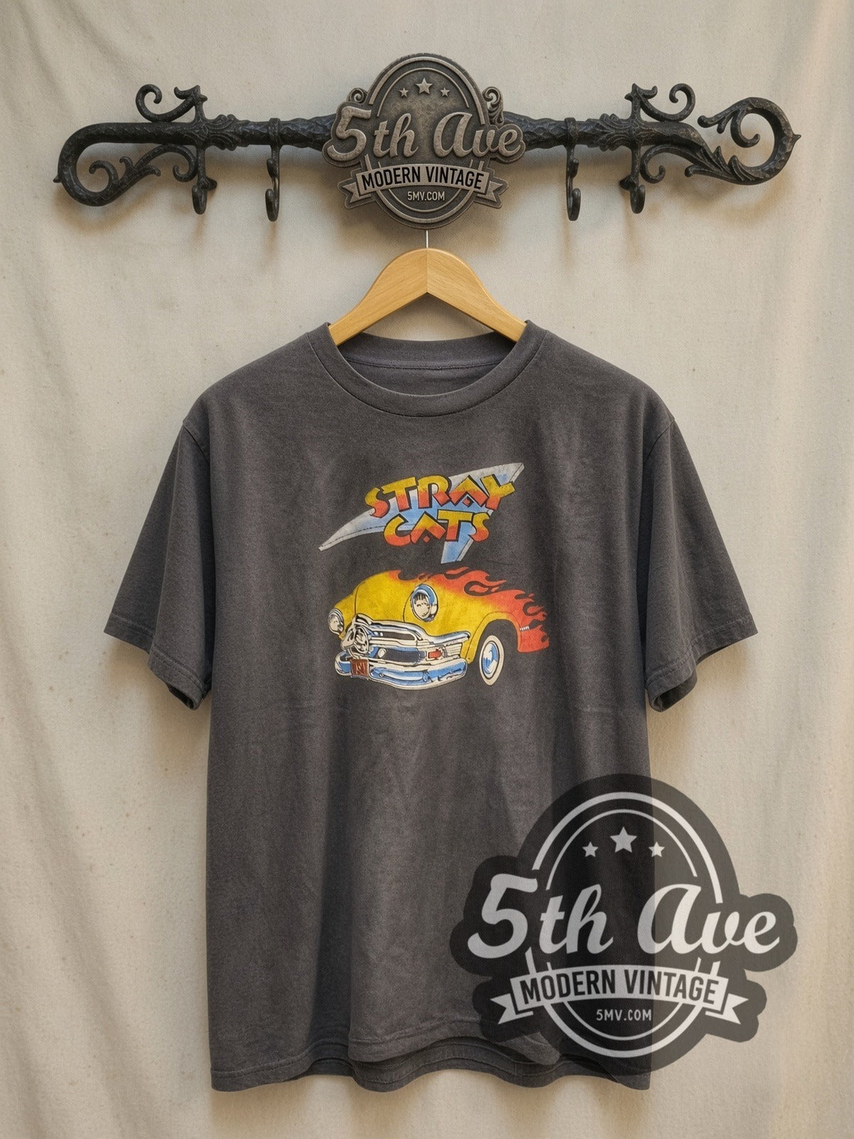 Stray Cats Flaming Hot Rod vintage band t-shirt, front view on a display rack