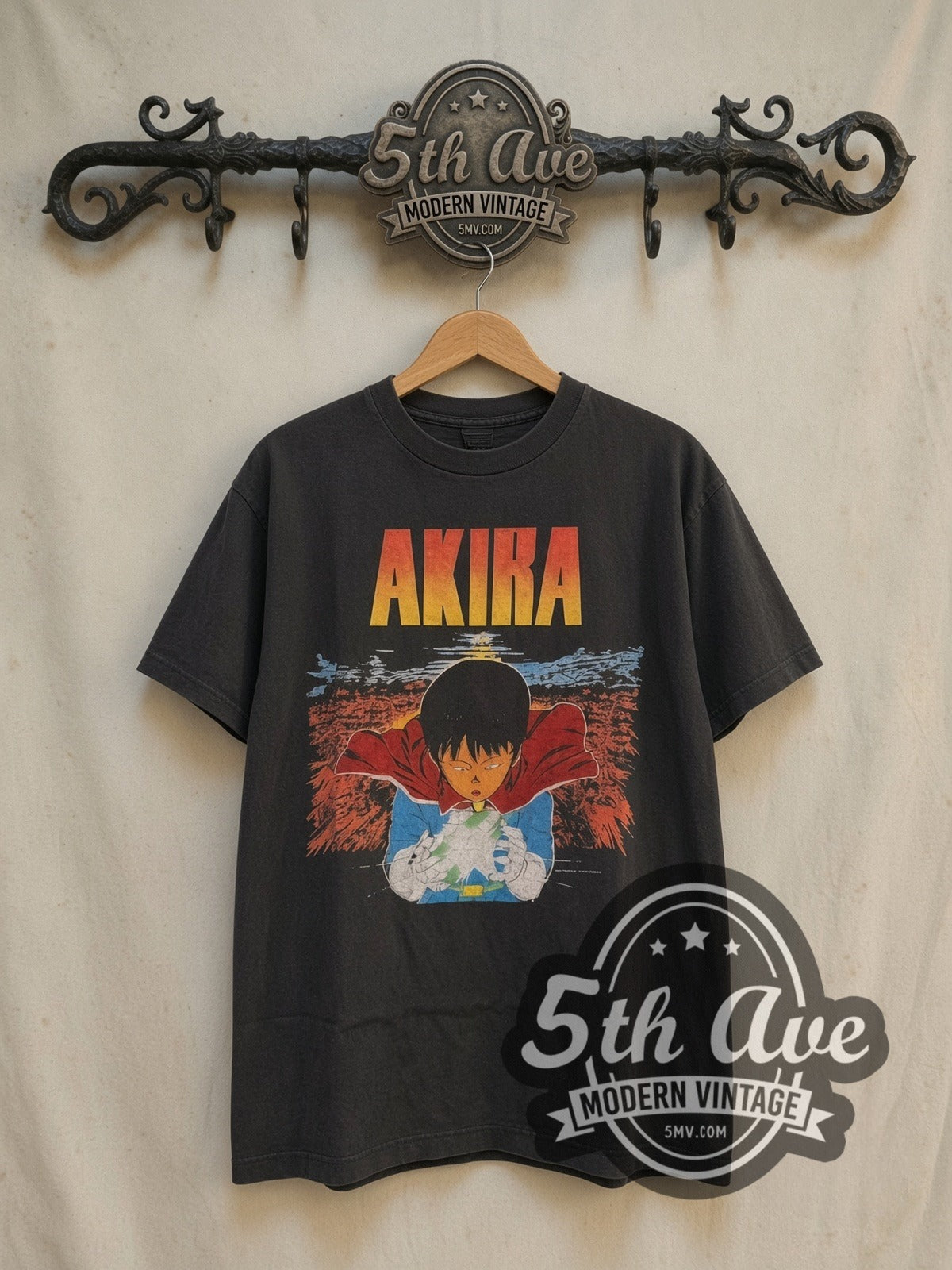 Akira Kaneda Glowing Energy Orb vintage anime t-shirt, front view on a display rack