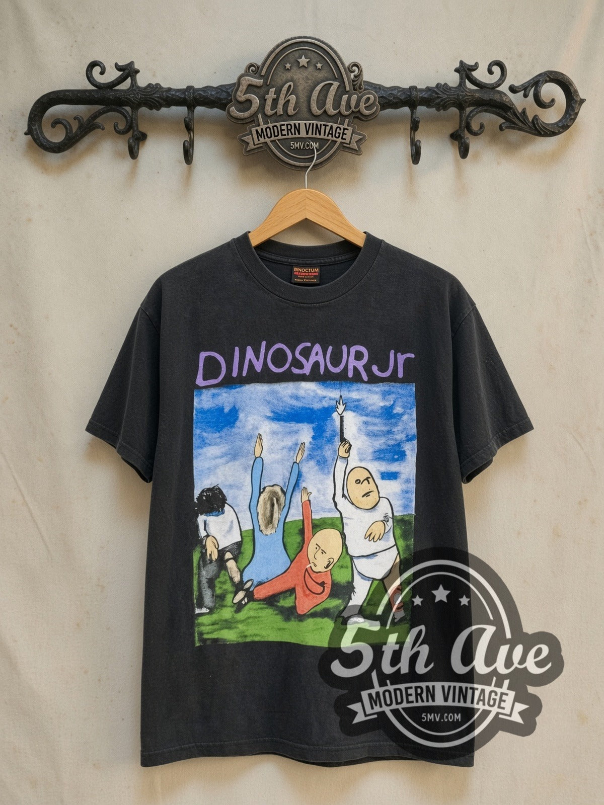 Dinosaur Jr. vintage band t-shirt in black, front view on a display rack