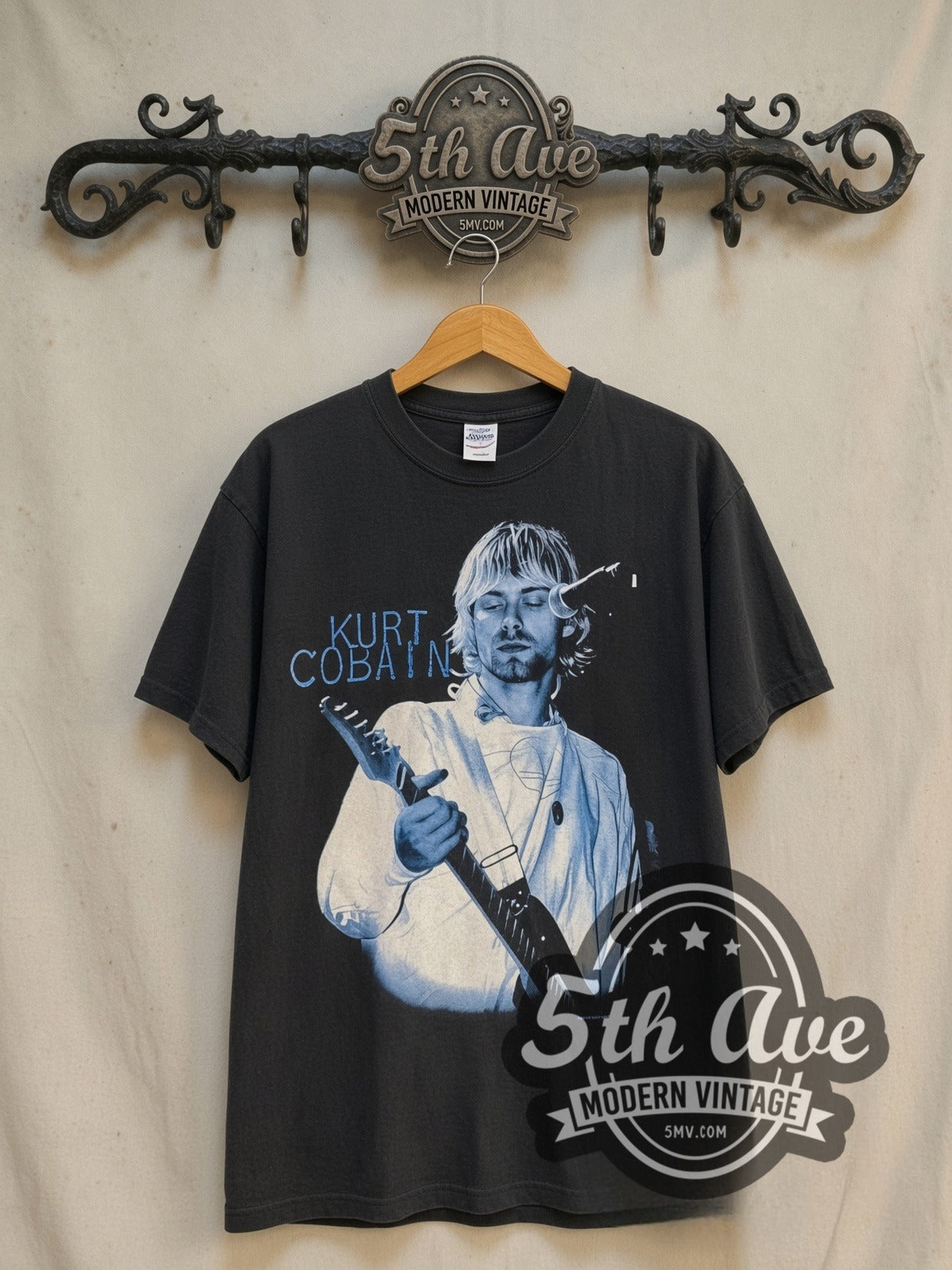 Nirvana Rape Me vintage band t-shirt in black, front view on a display rack